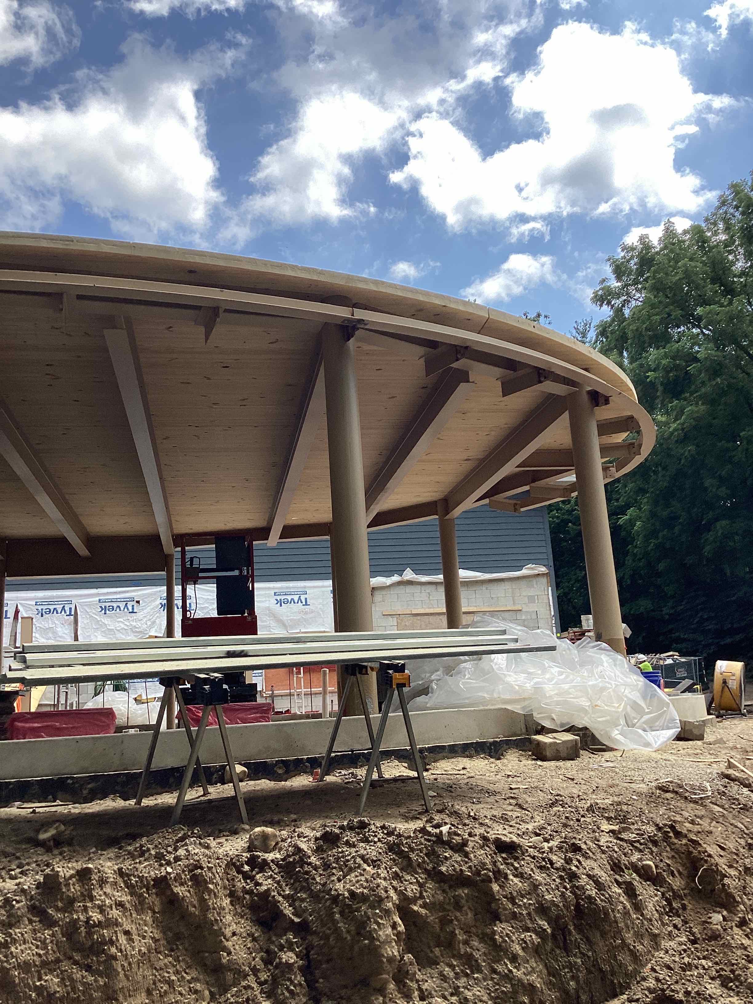 Under Construction Mass Timber in a circle formation with posts and CLT ceilings.