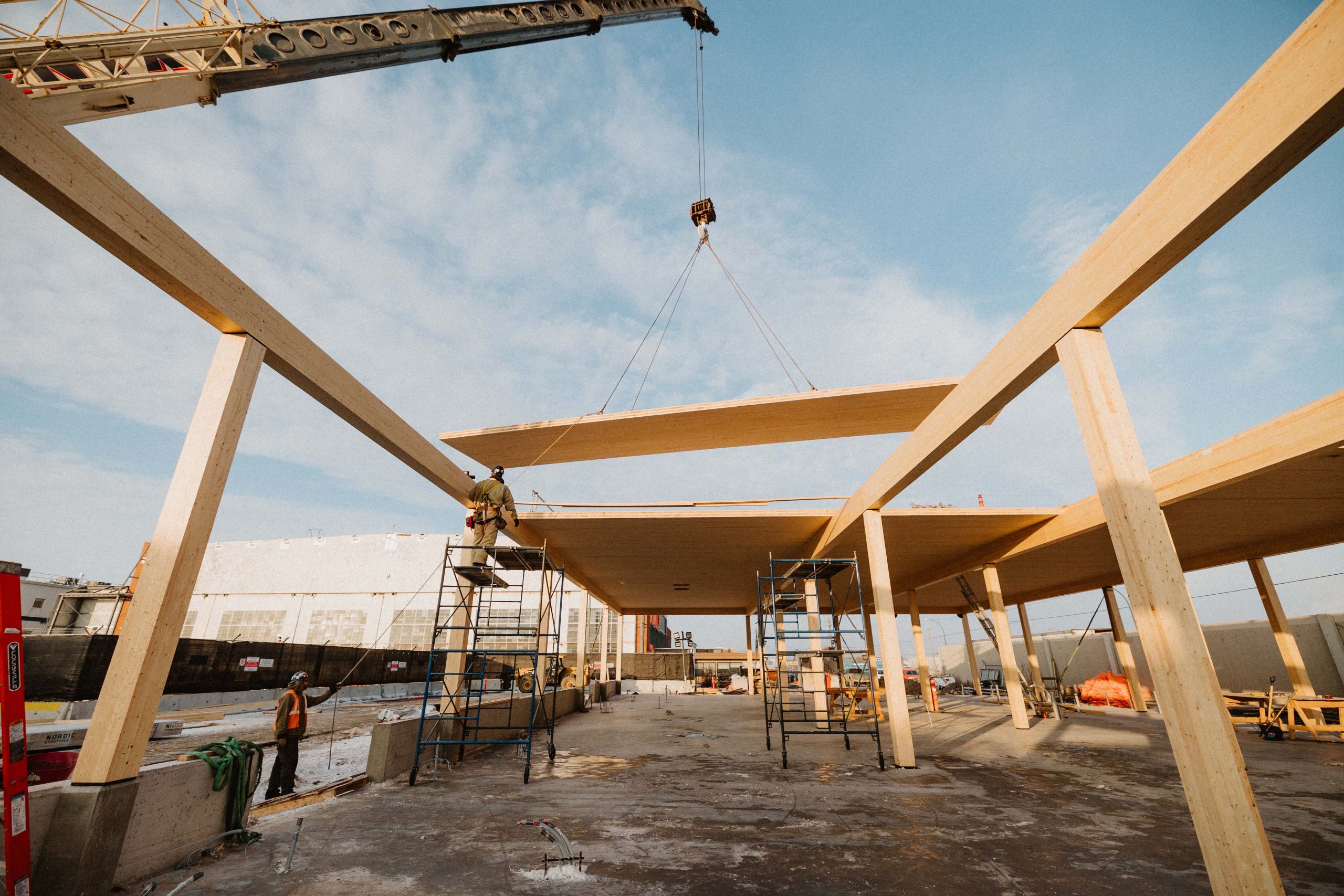 CLT Panels mass timber going into place on an exterior construction site. 