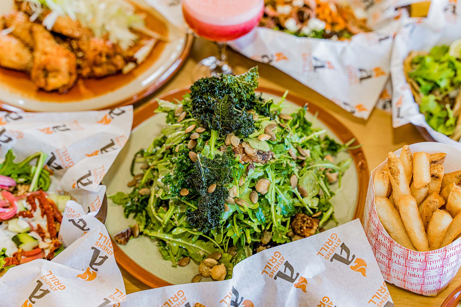 A plate of food with a salad on top.