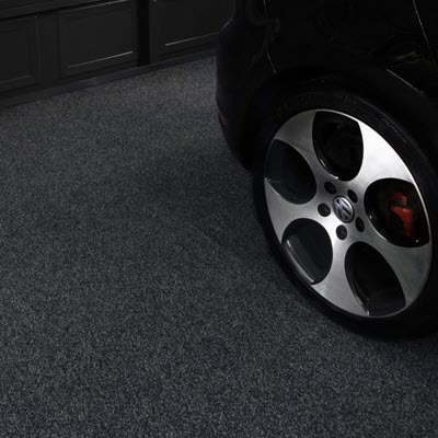 Car parked on anthracite garage carpet