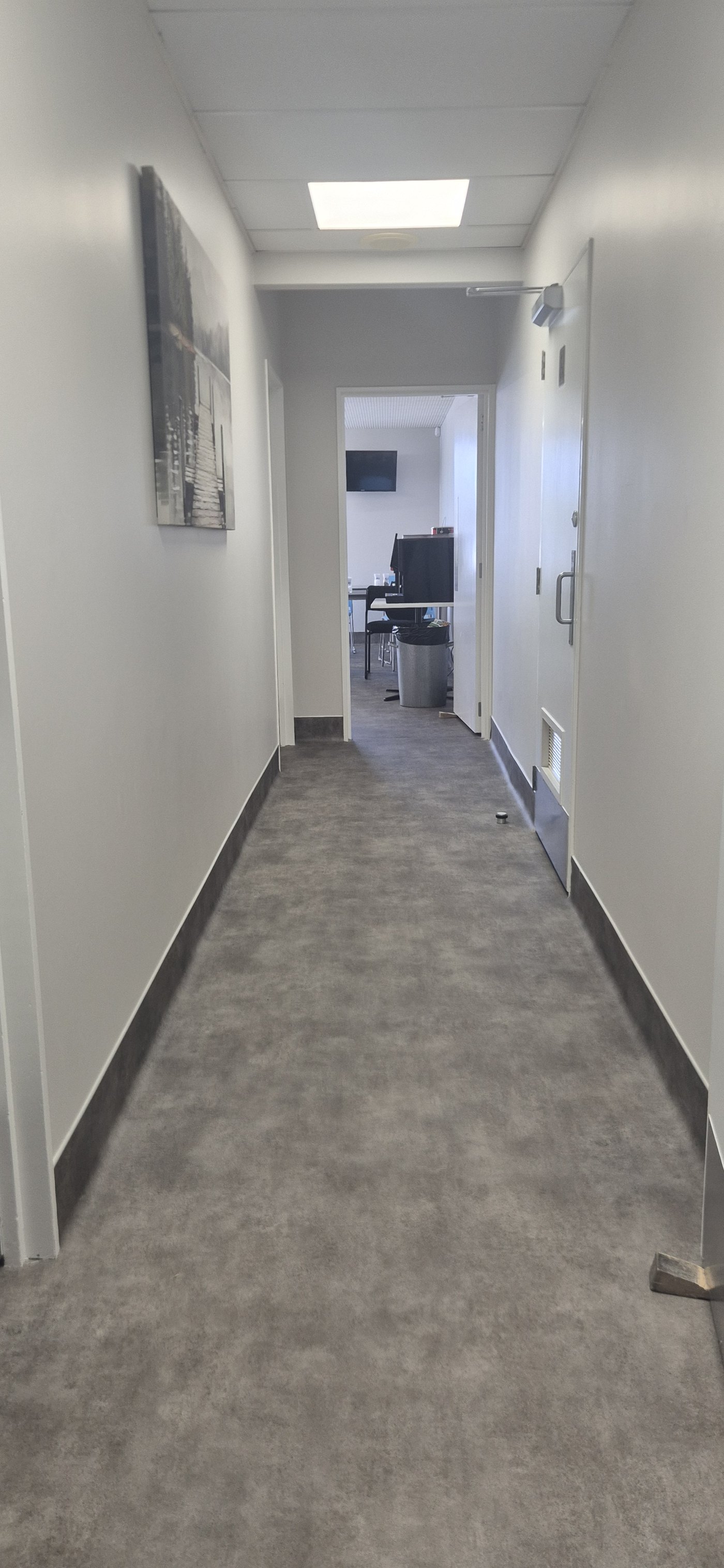 Welded safety vinyl and coved skirting through a corridor at BestStart Cameron Road, Tauranga