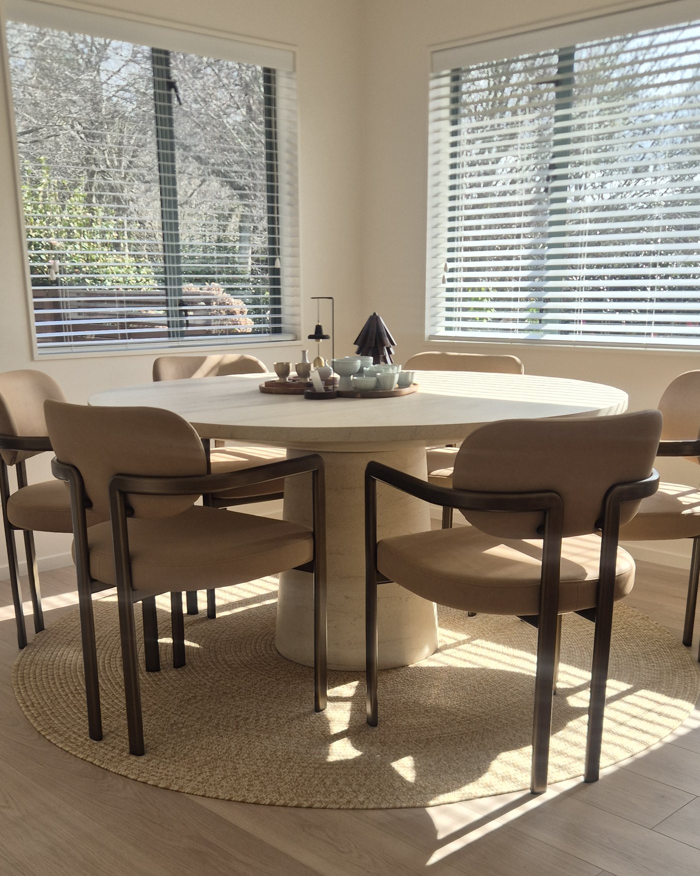 Armstrong Queenstown laminate in a sunlit dining room with a round table