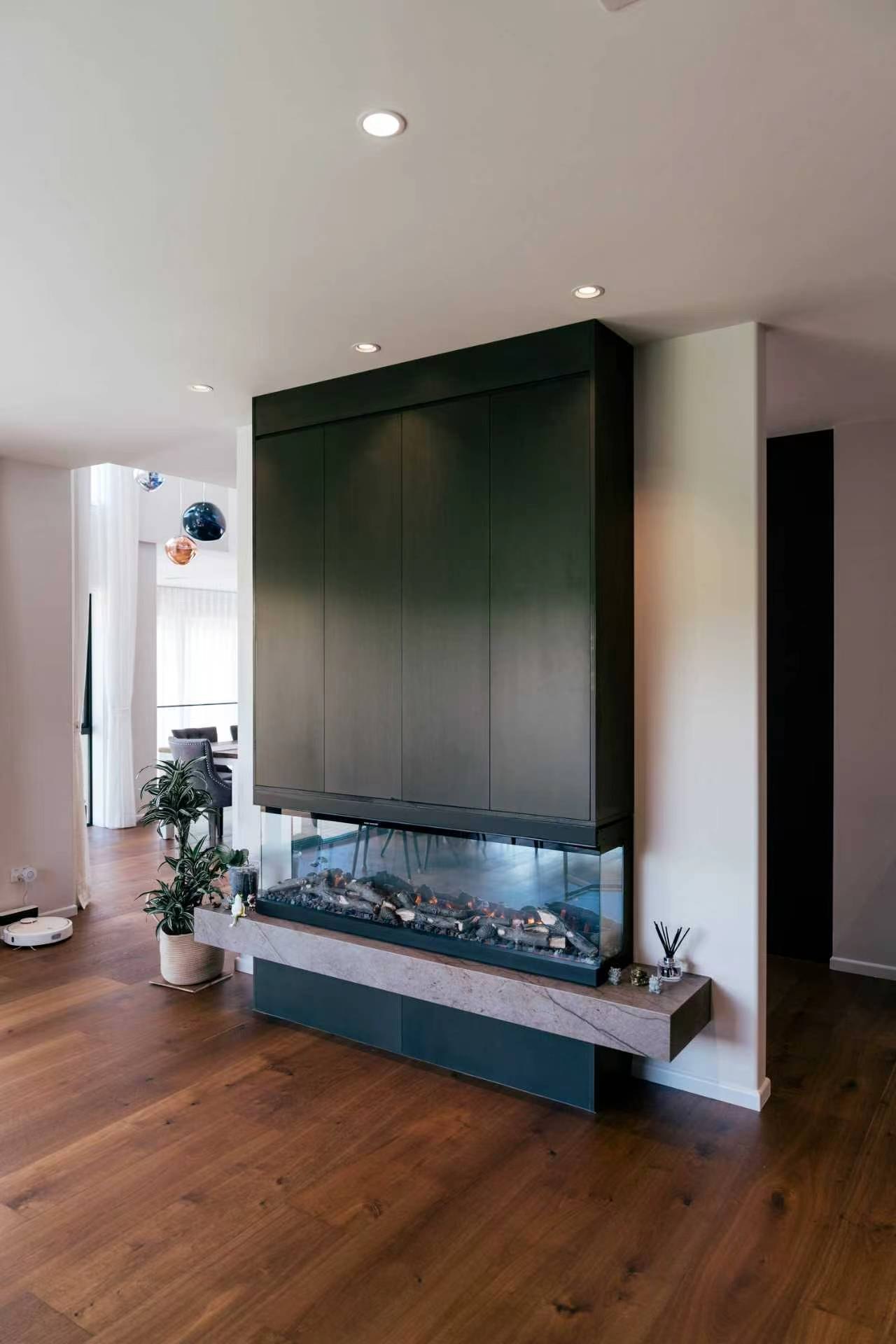 Dark toned oak timber flooring beside a feature fireplace, laid by Floorical in Tauranga
