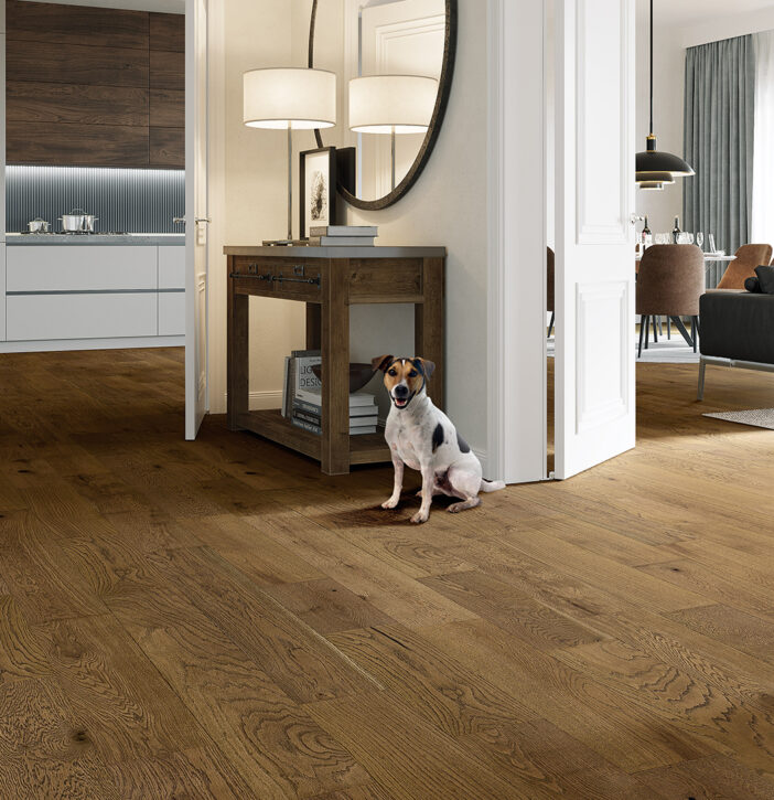 Oak look laminate flooring running through an open plan living and kitchen area
