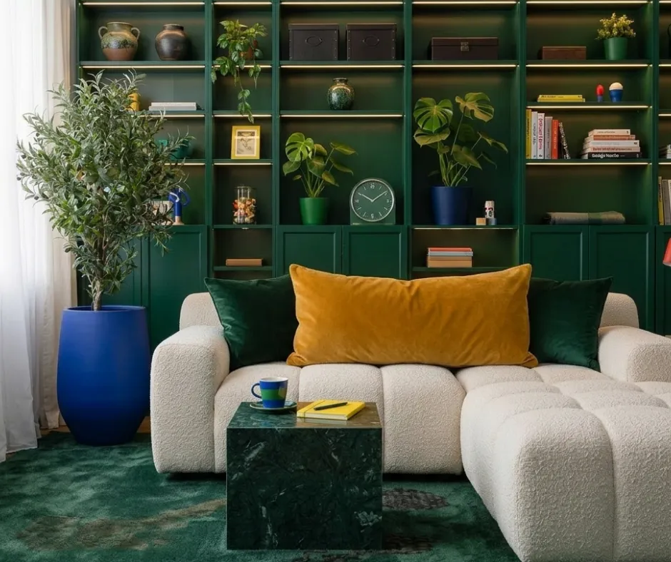 Deep teal plush carpet in a green library room with a boucle sofa