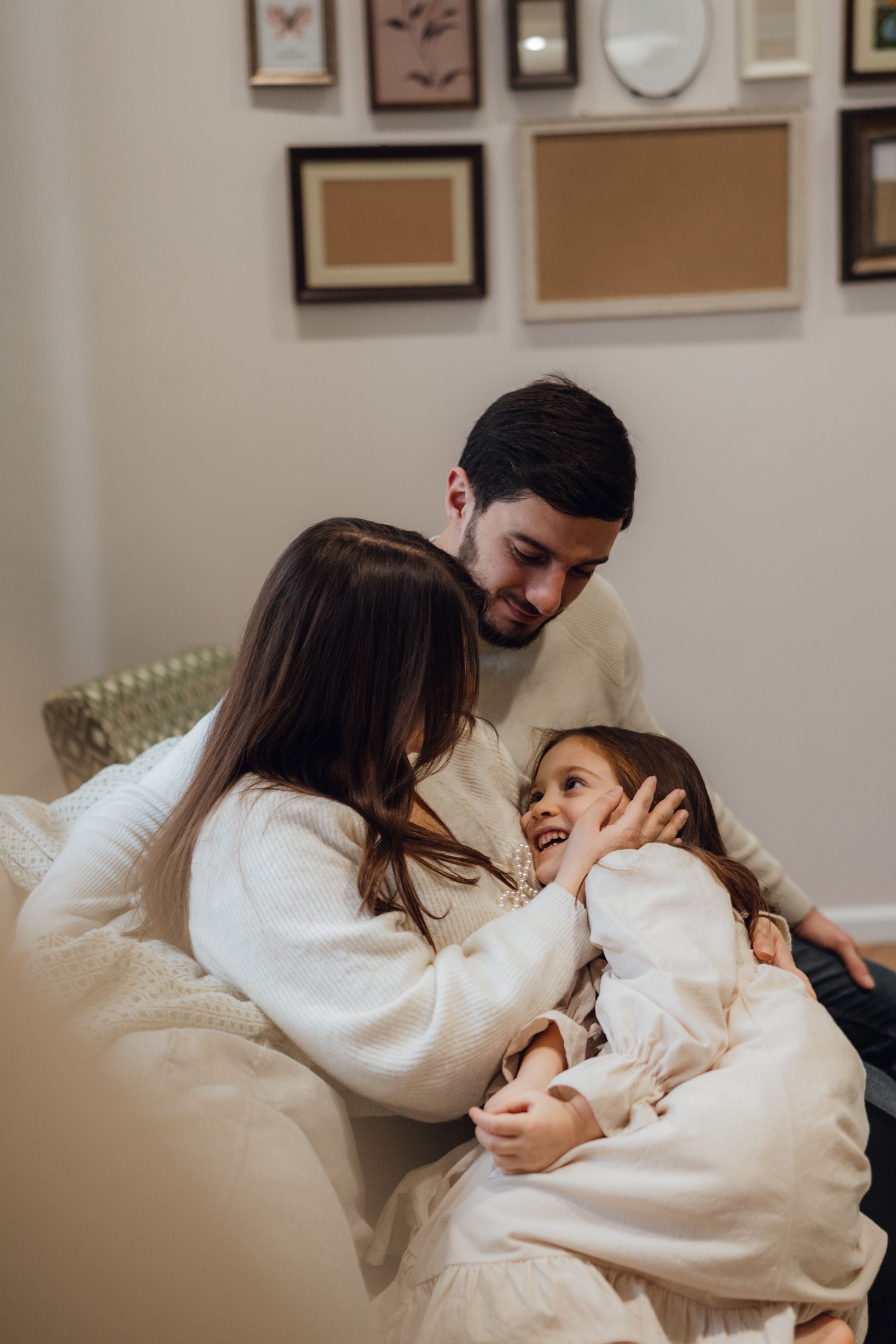 Family relaxing together on a couch at home