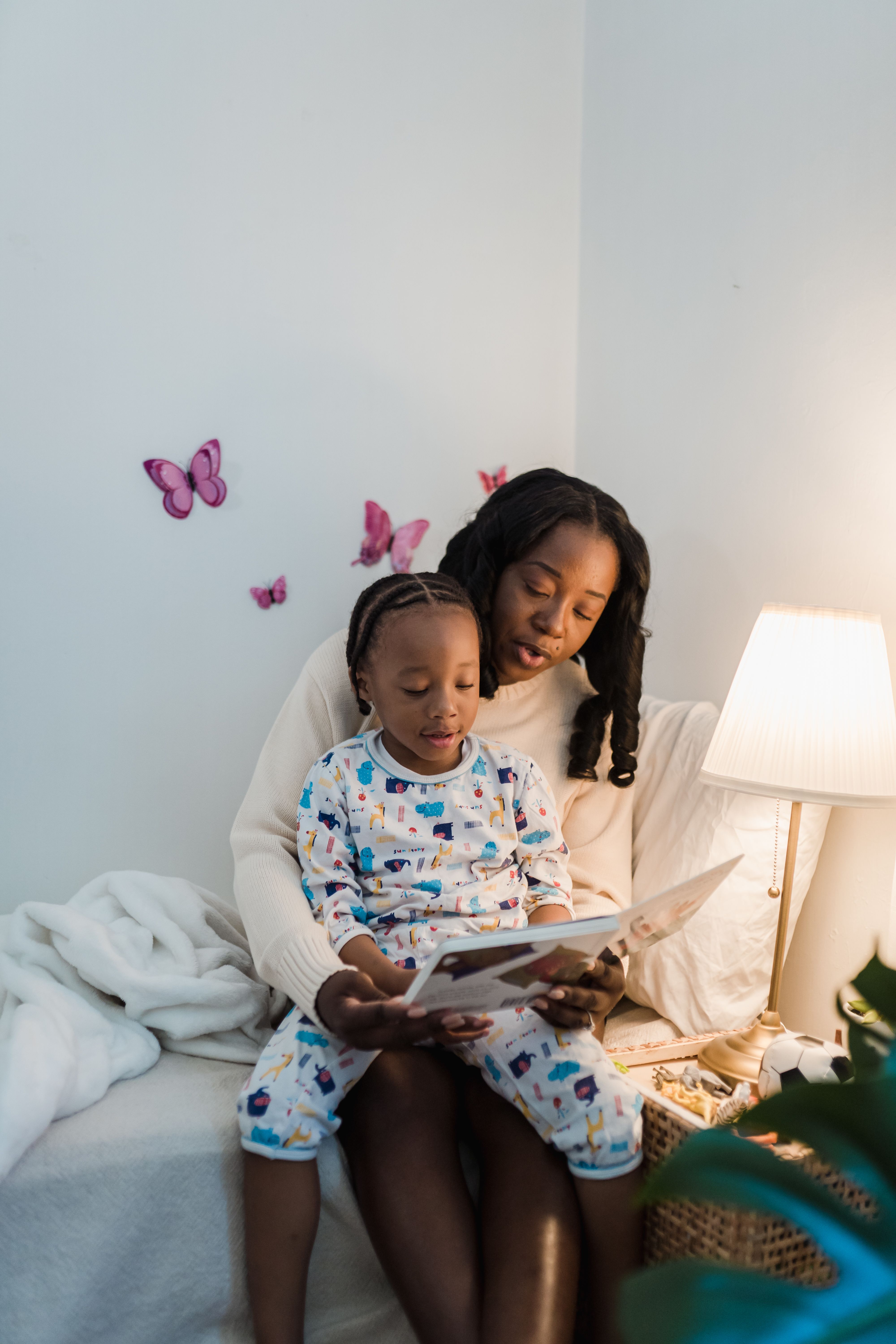 Mother and daughter reading a book together