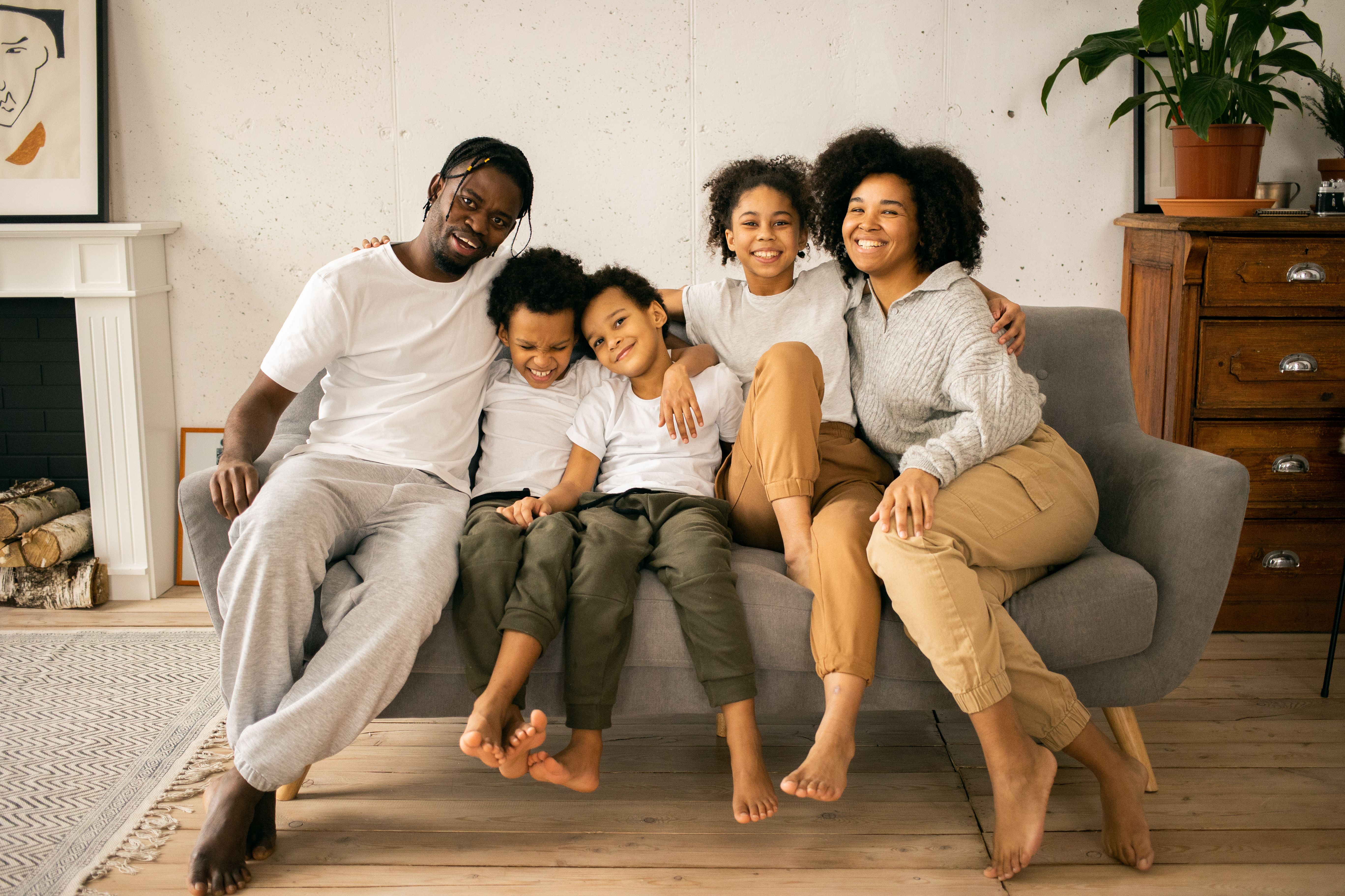 Smiling family resting together on a couch