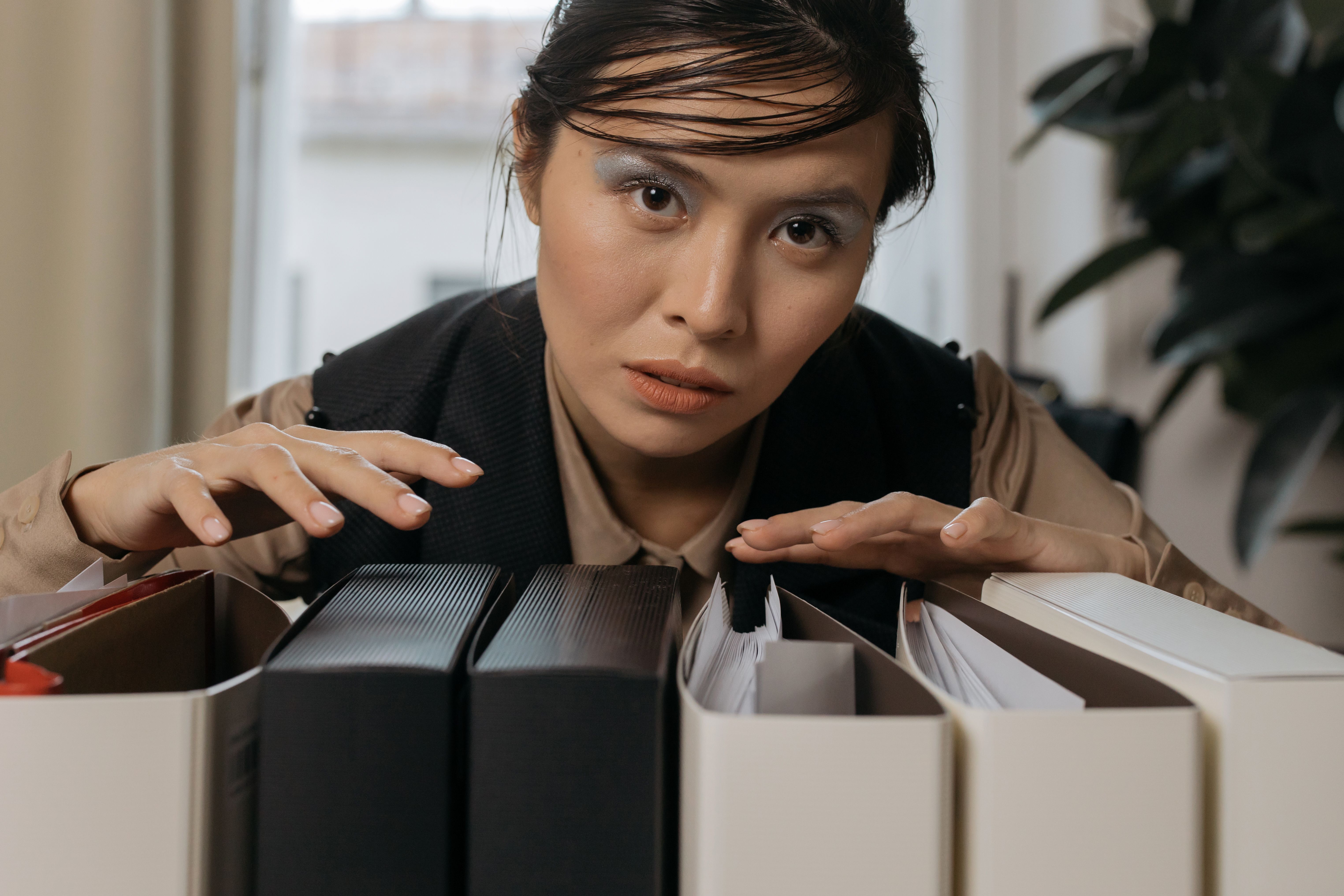 Woman organizing hands over file folders