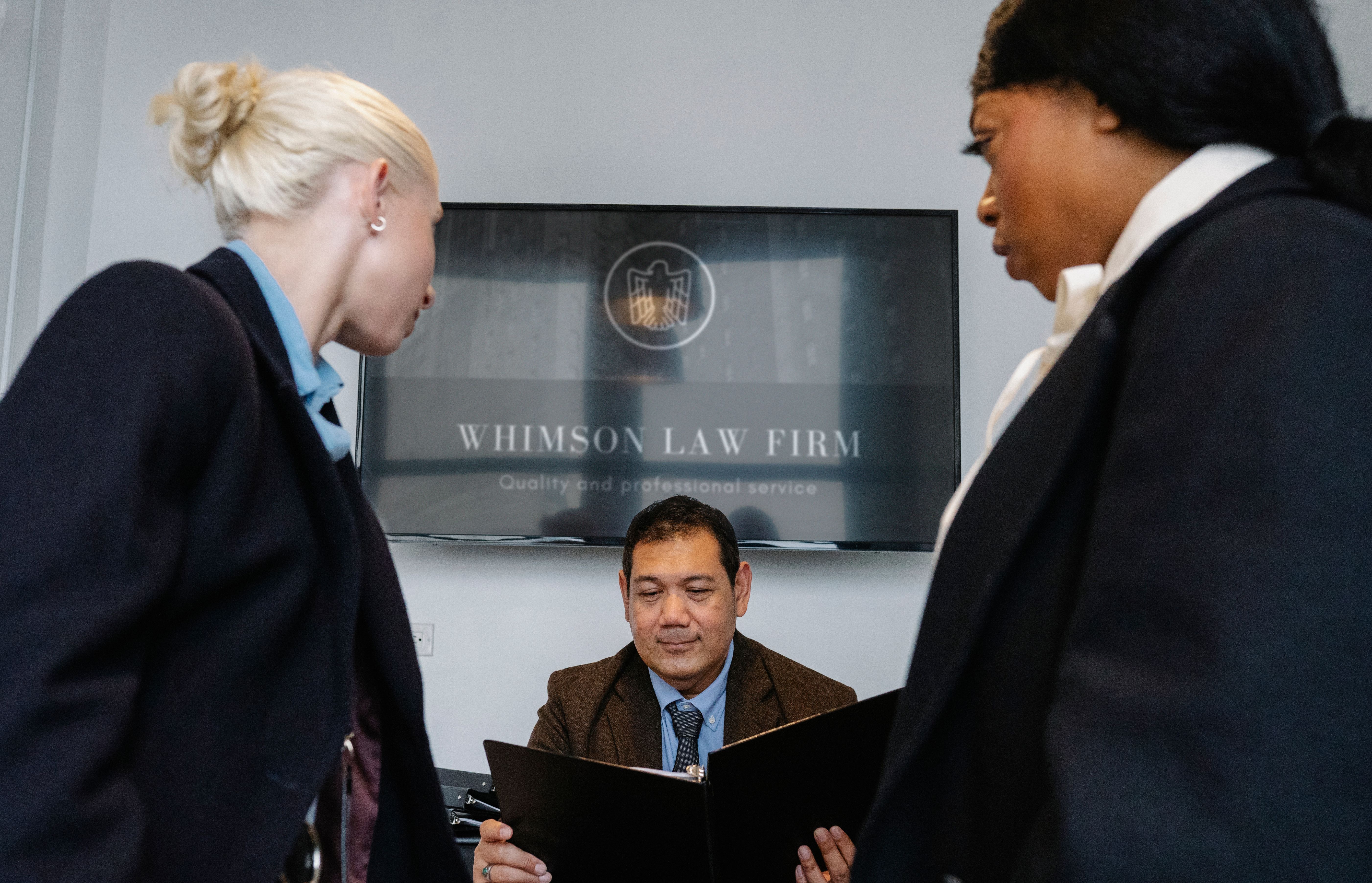 Group of coworkers meeting in a law office