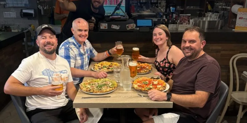 INCEPTION team members sharing pizza and drinks