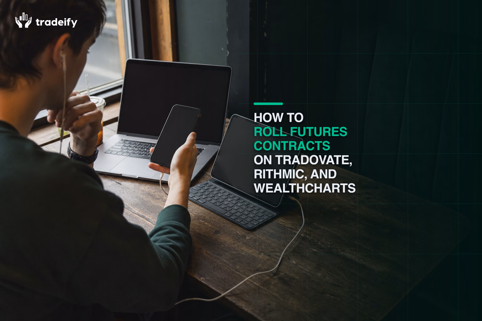 Phone-first trader comparing contract month details on a tablet and laptop before a futures rollover