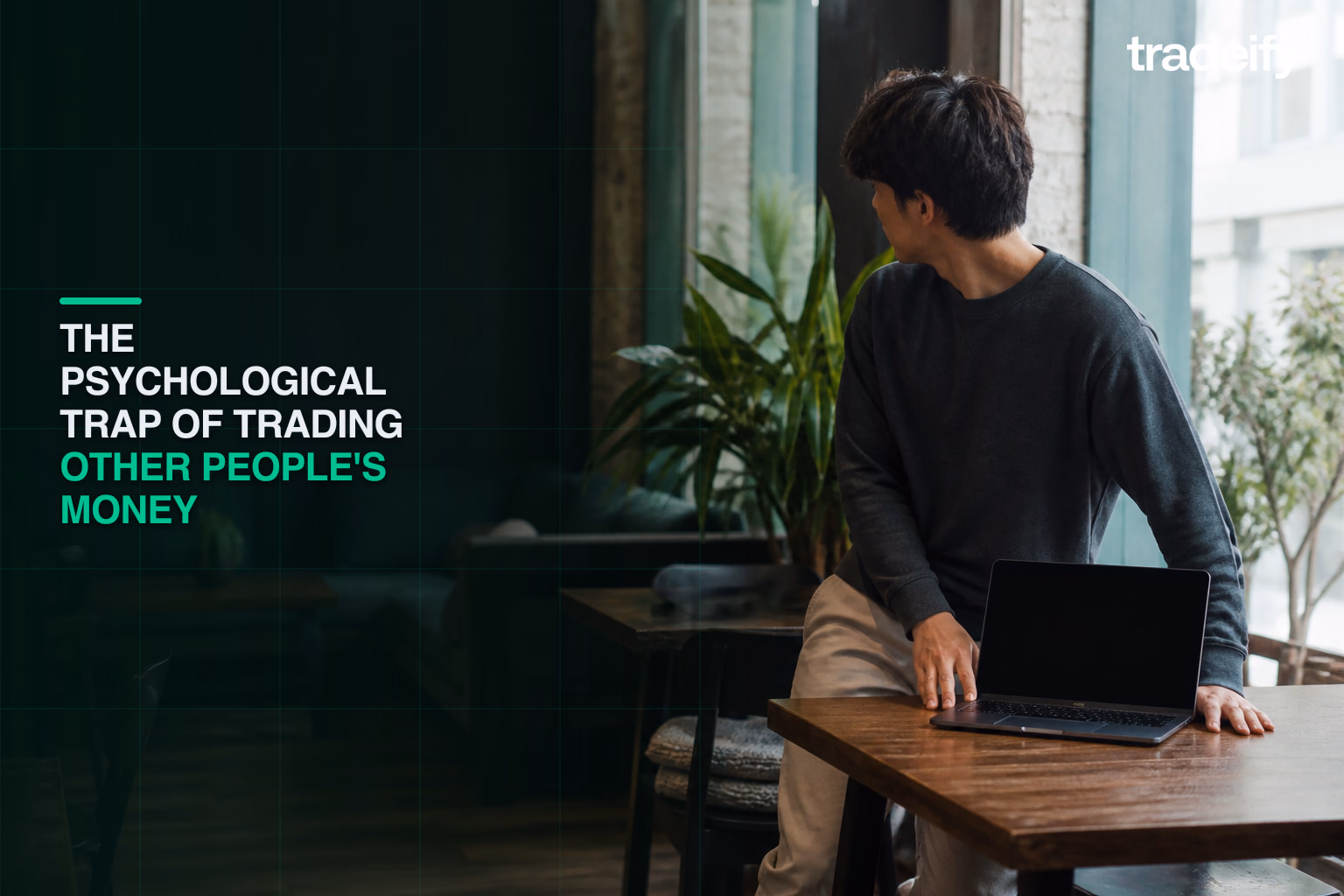 Young funded trader stepping away from a laptop to reset before making another decision
