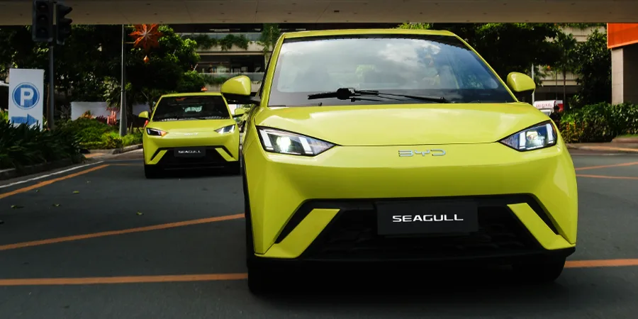 Two BYD Seagull electric cars driving in the city, symbolizing the growth of the EV industry and adoption in the Philippines