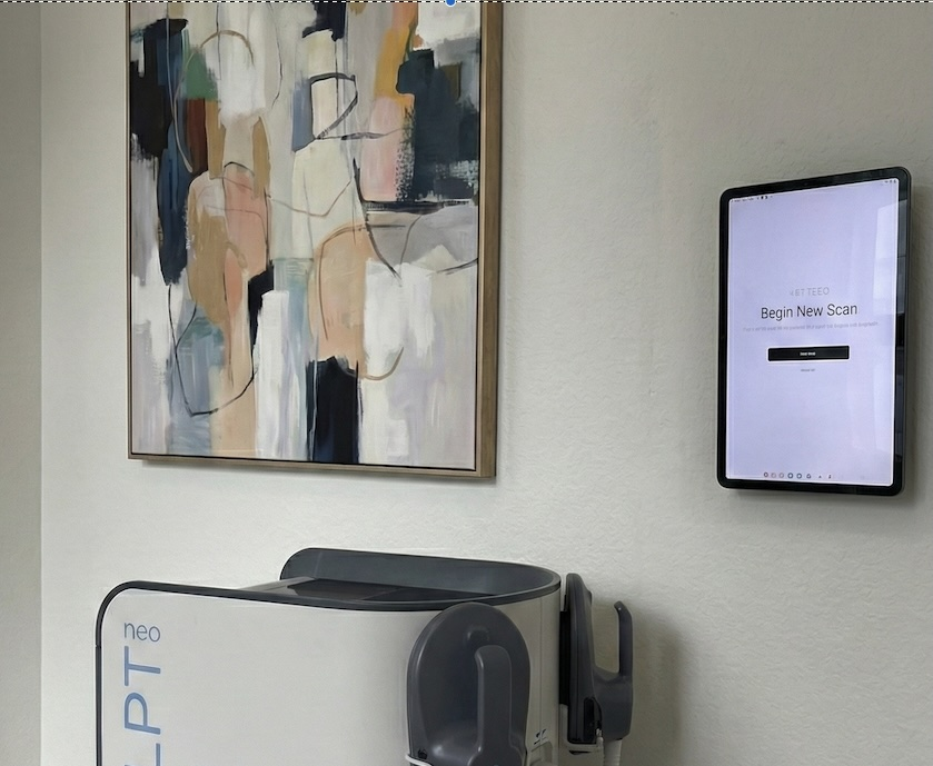 Wall-mounted tablet showing Begin New Scan, from the SNAP service page