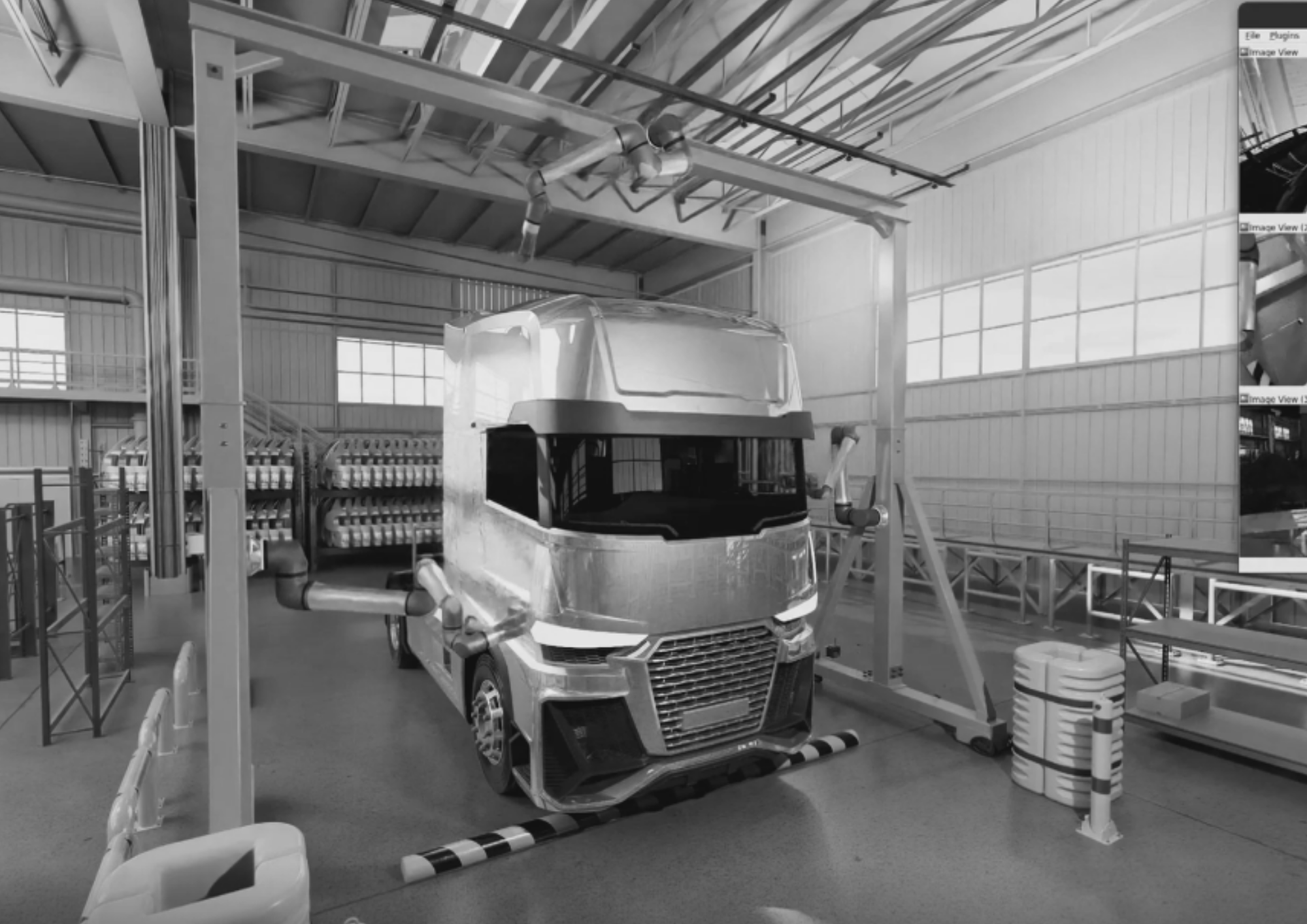Black and white image of a large industrial workshop featuring a modern semi-truck positioned under a ceiling-mounted inspection or assembly gantry. The environment includes structured lighting, safety barriers, storage racks, and various equipment, indicating a heavy vehicle manufacturing or inspection station.