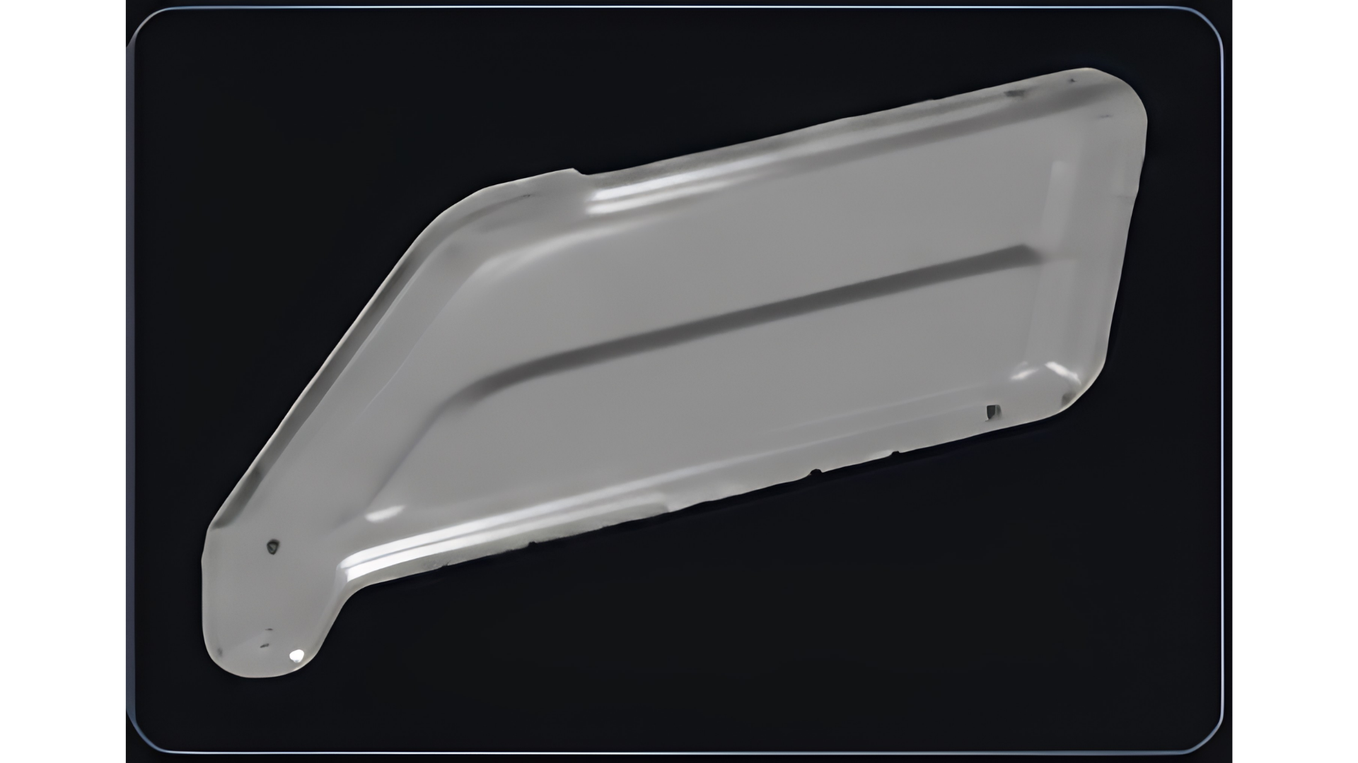 Gray irregularly shaped, flat plastic panel with curved and angular edges on a black background.