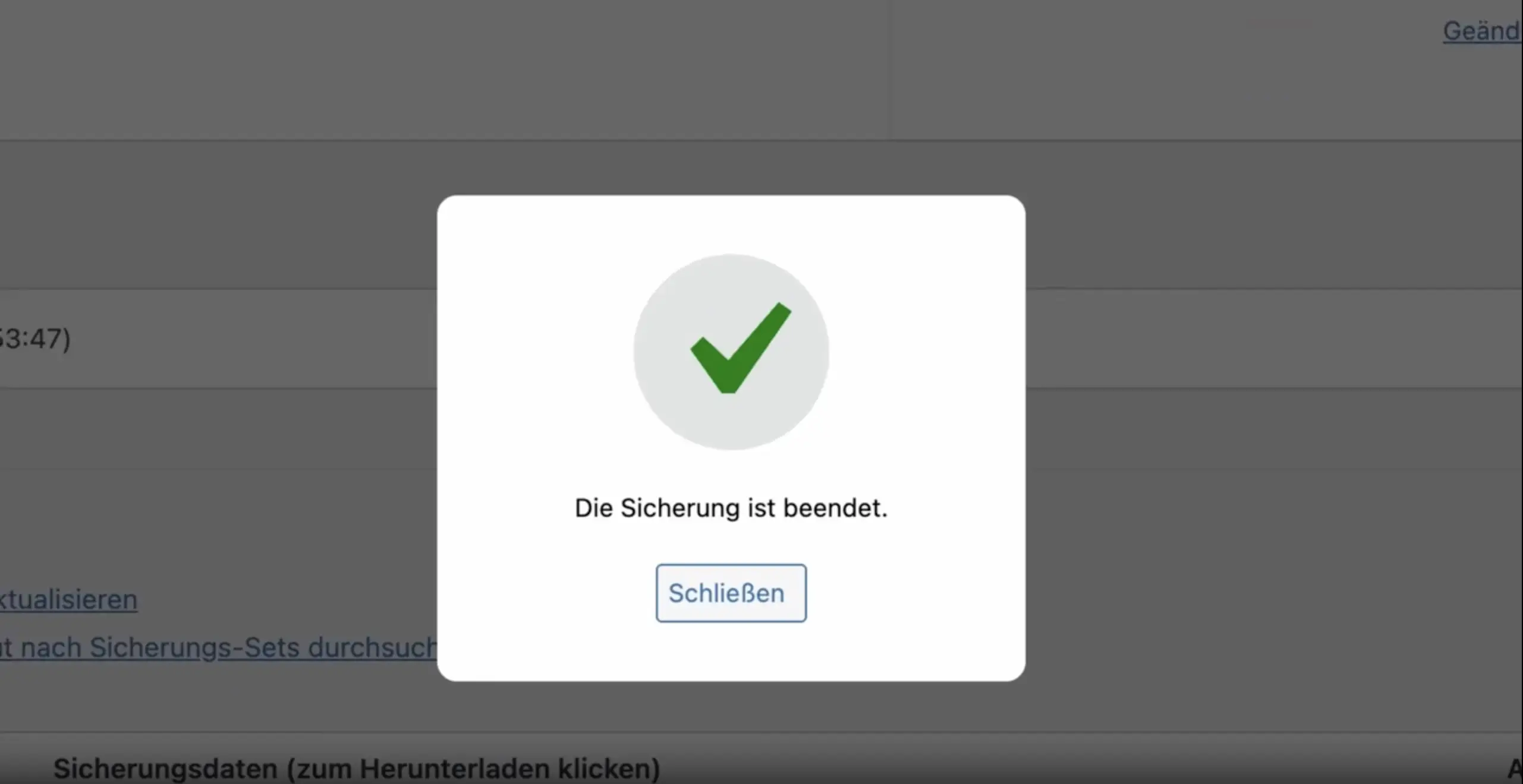 Pop-up-Fenster mit grünem Häkchen und der Nachricht ‚Die Sicherung ist beendet.‘ sowie einem Button ‚Schließen‘.