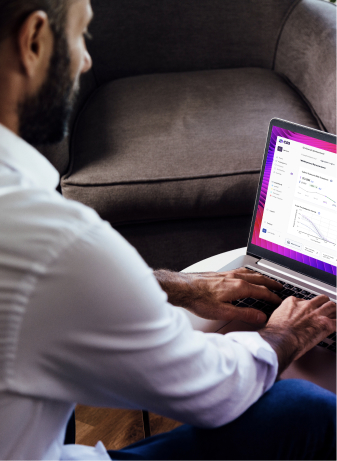 A man working on a laptop showing CRI app