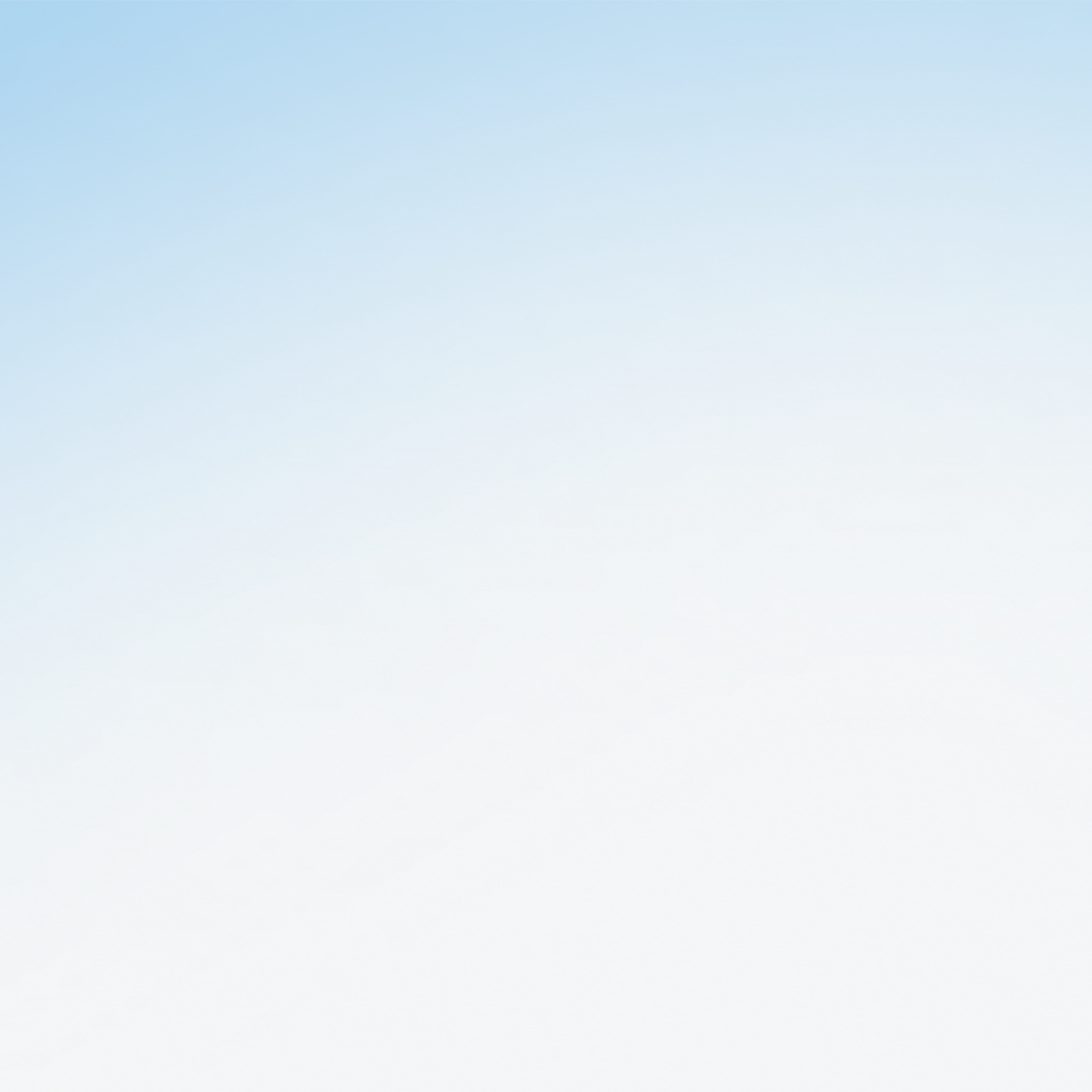 Illustration of a castle with two teal towers and a gray base on a light blue sky background.