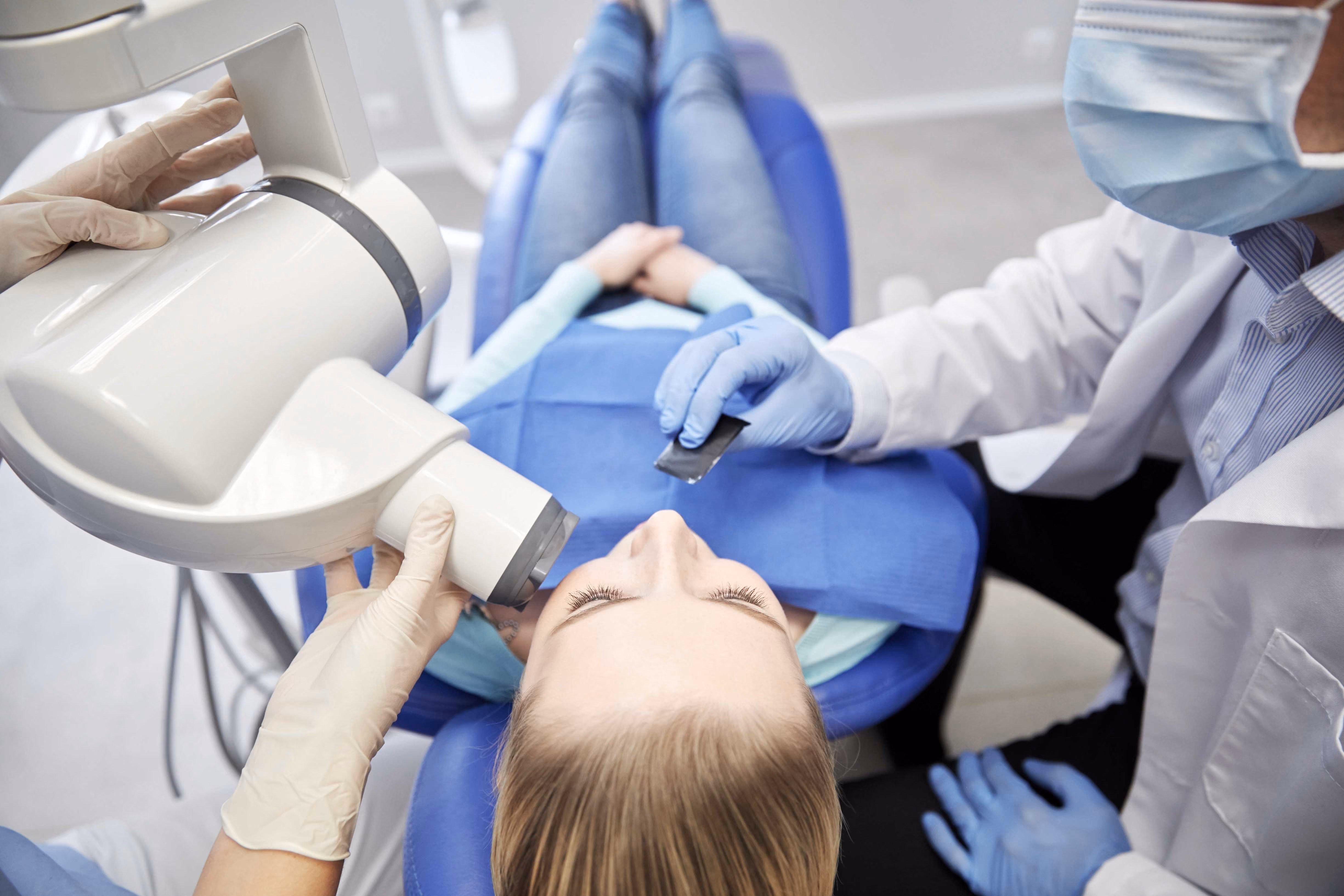 Dental nurse performing a dental check up. 
