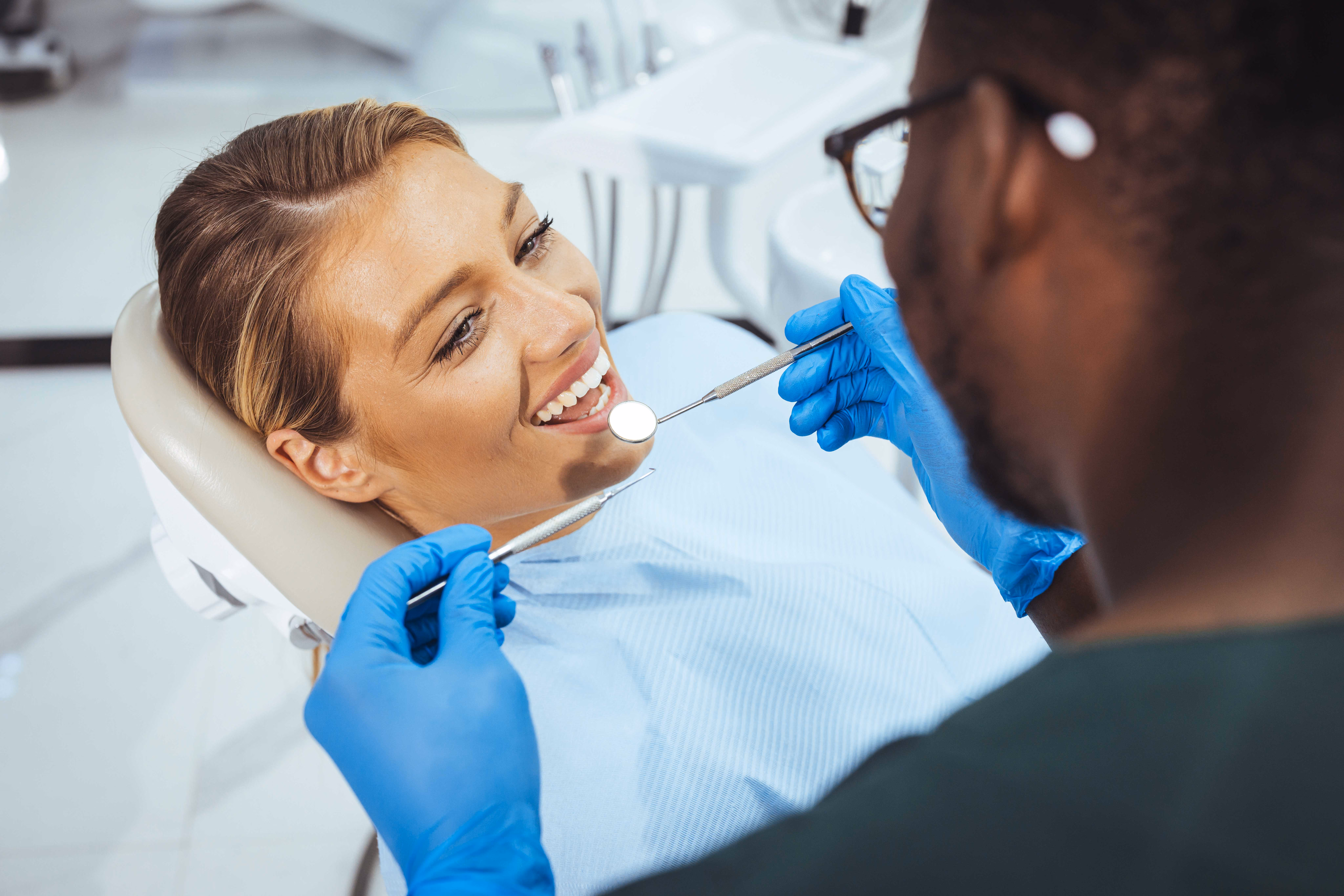 A dentist conducting a dental procedure. 