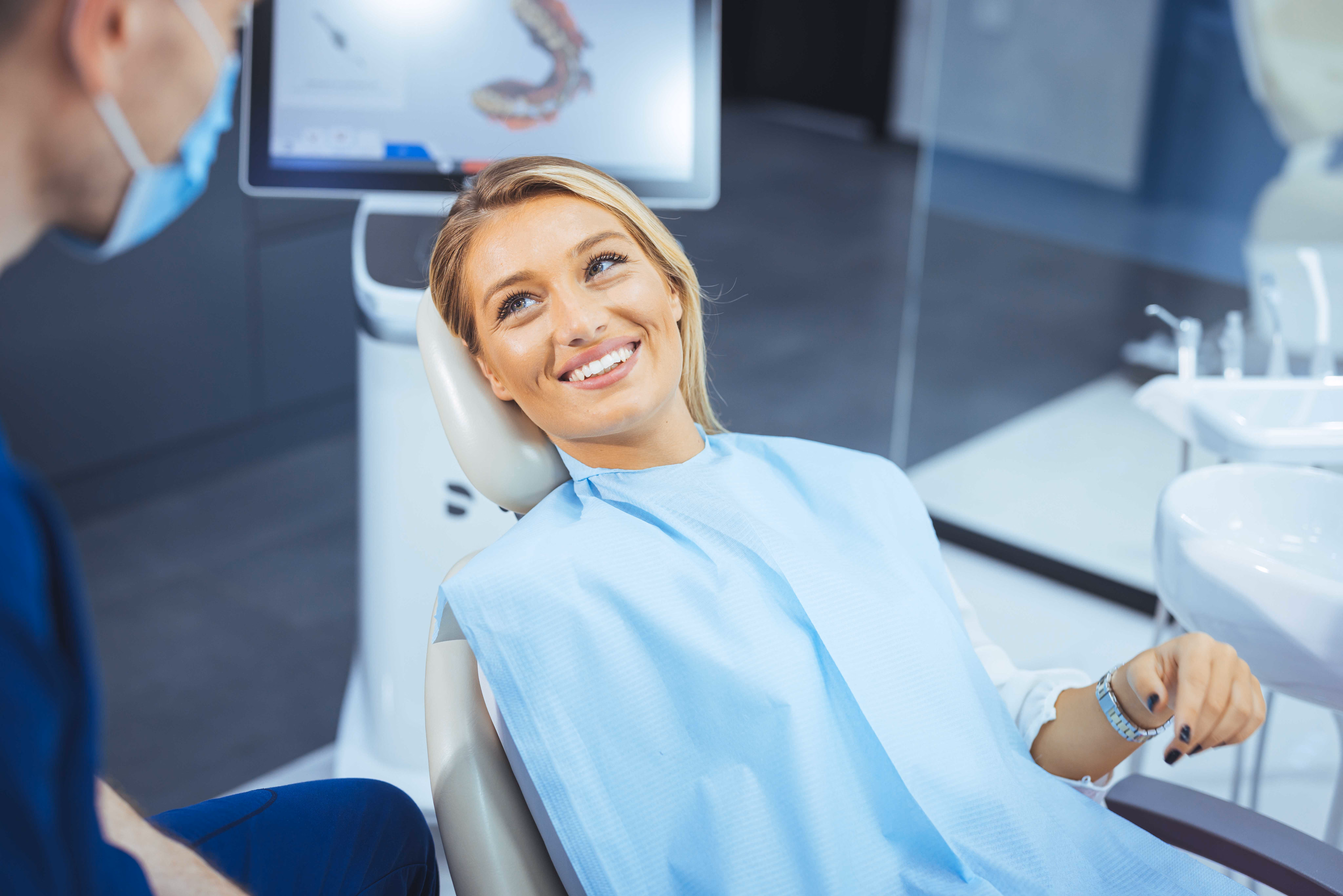 Dentist performing a dental check up.