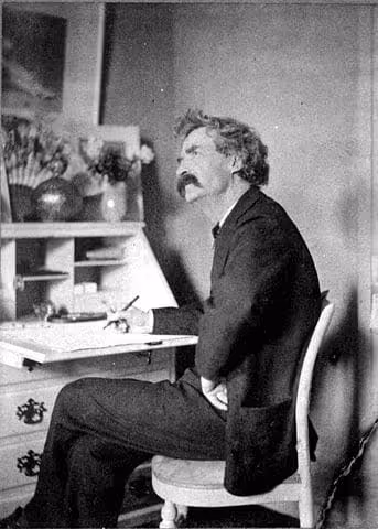 343px-Mark_Twain_pondering_at_desk
