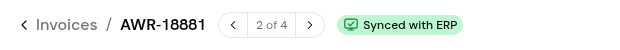The invoice header with the Synced with ERP chip next to the invoice number.