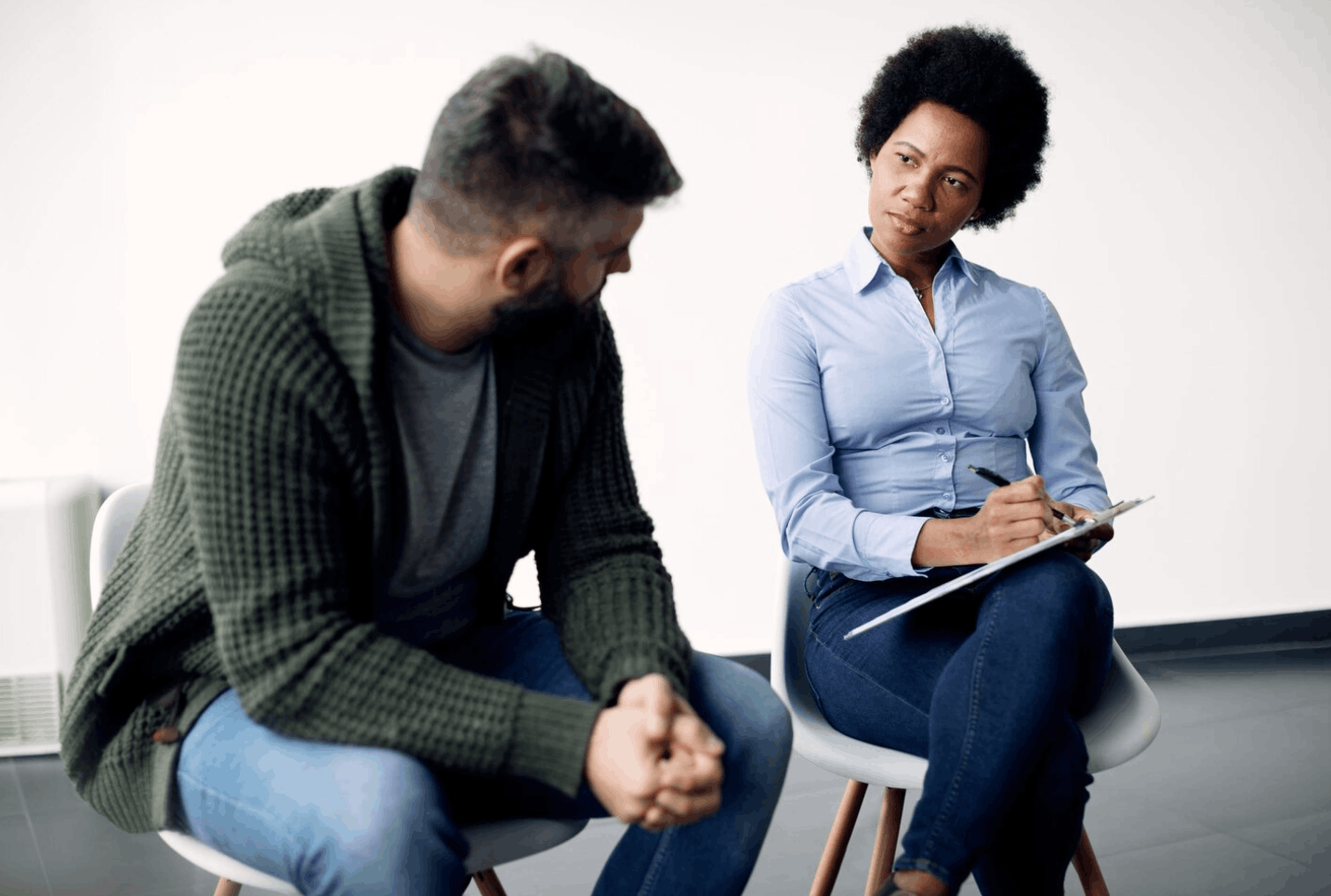 Therapist taking notes during PHP treatment session in South Carolina