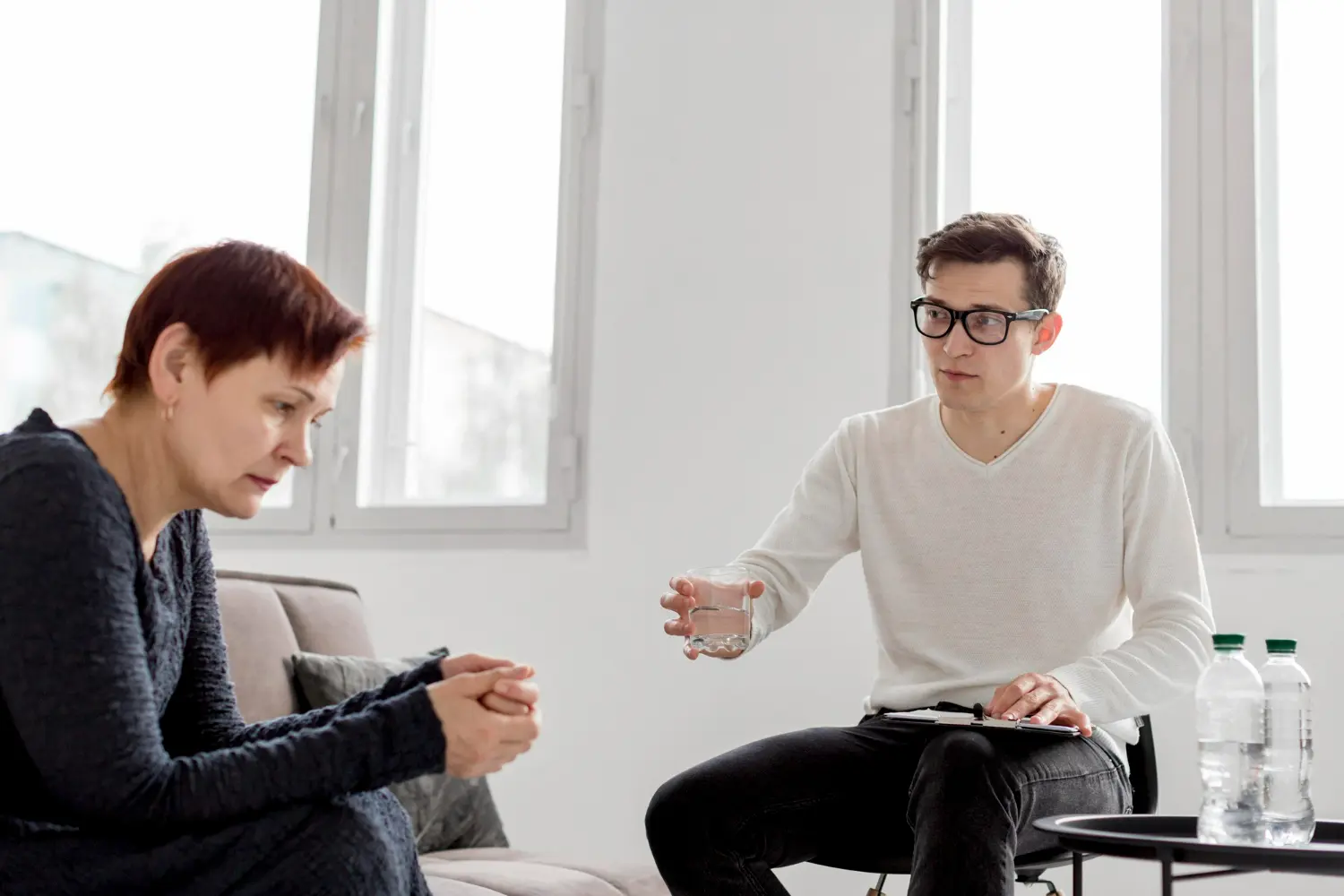 Psychologist counseling addiction patient on substance use disorder