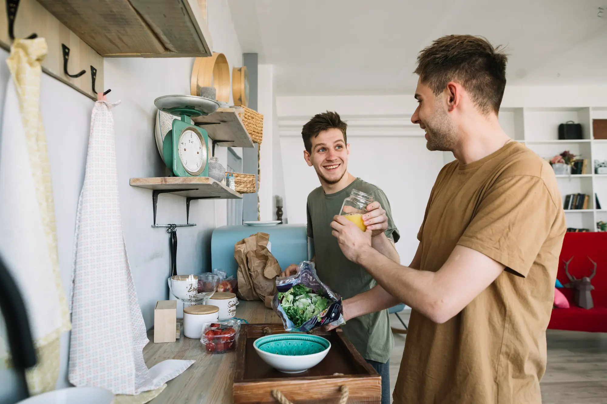 Two men preparing a healthy meal together in a supportive residential treatment setting