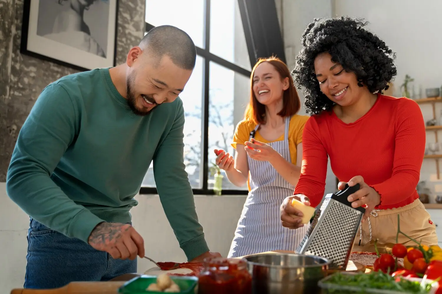 Three adults preparing a healthy meal together as part of a PHP treatment activity