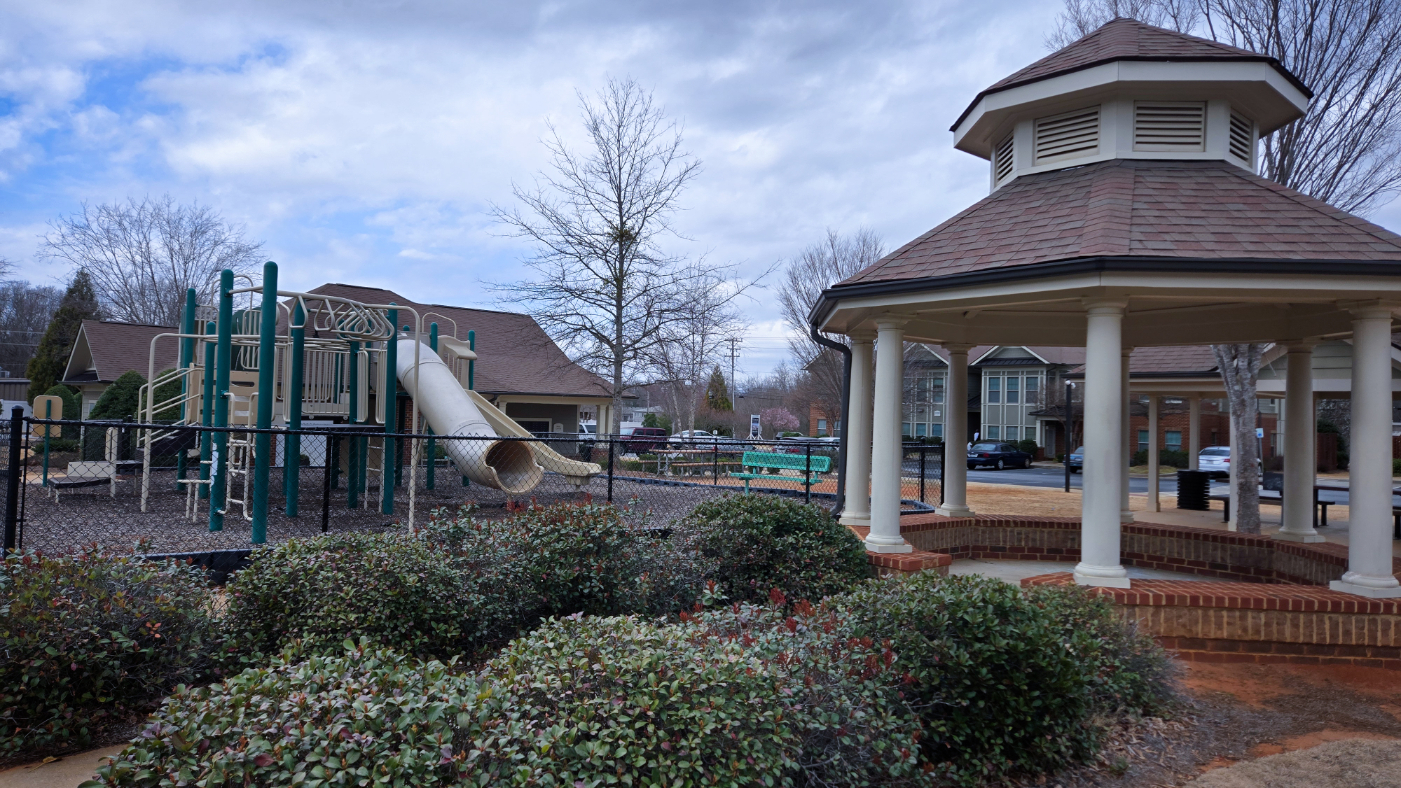Covered seating area with view of playground