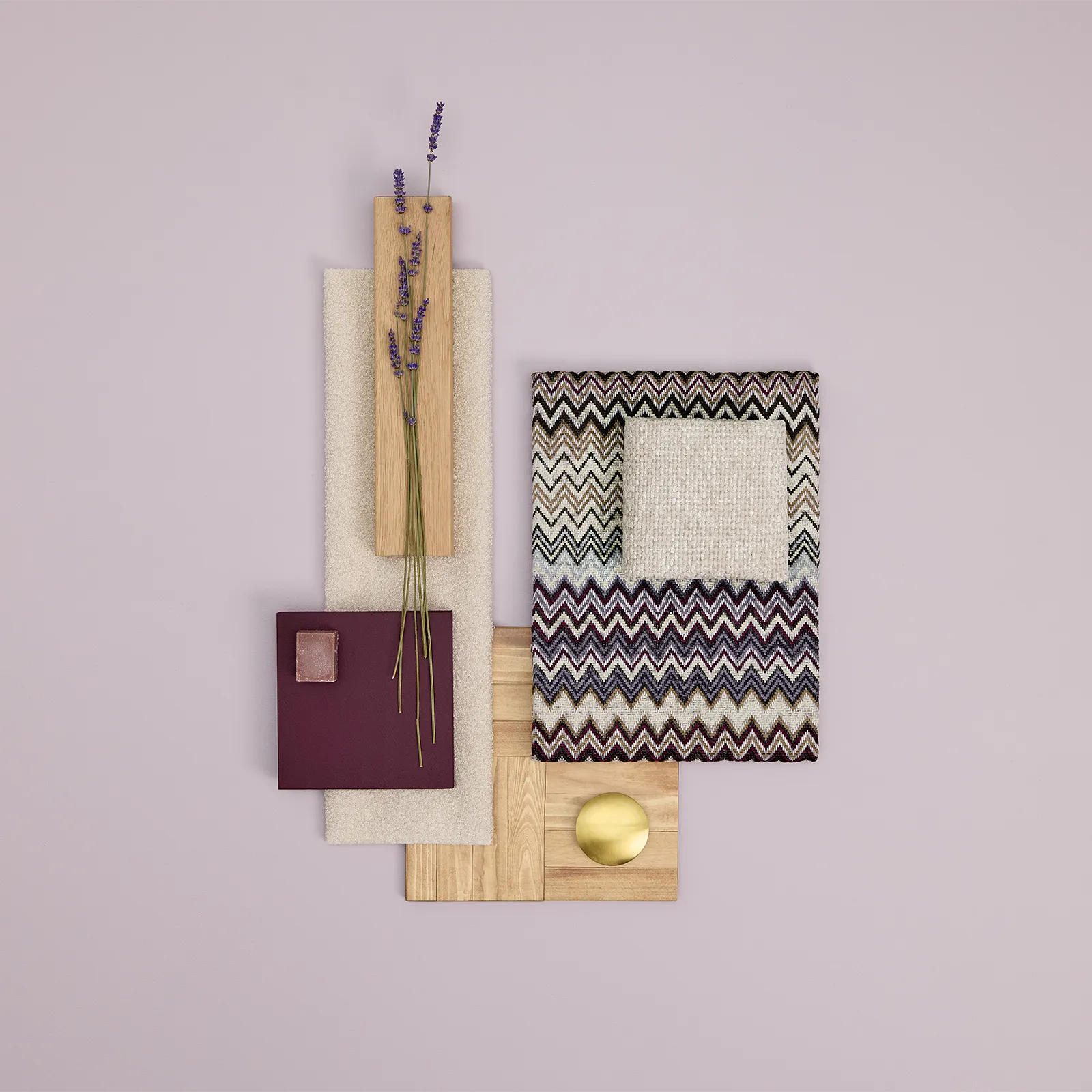 Flat lay of purple lavender sprigs, wood samples, textured fabric swatches, and a round brass knob arranged on a light mauve background.