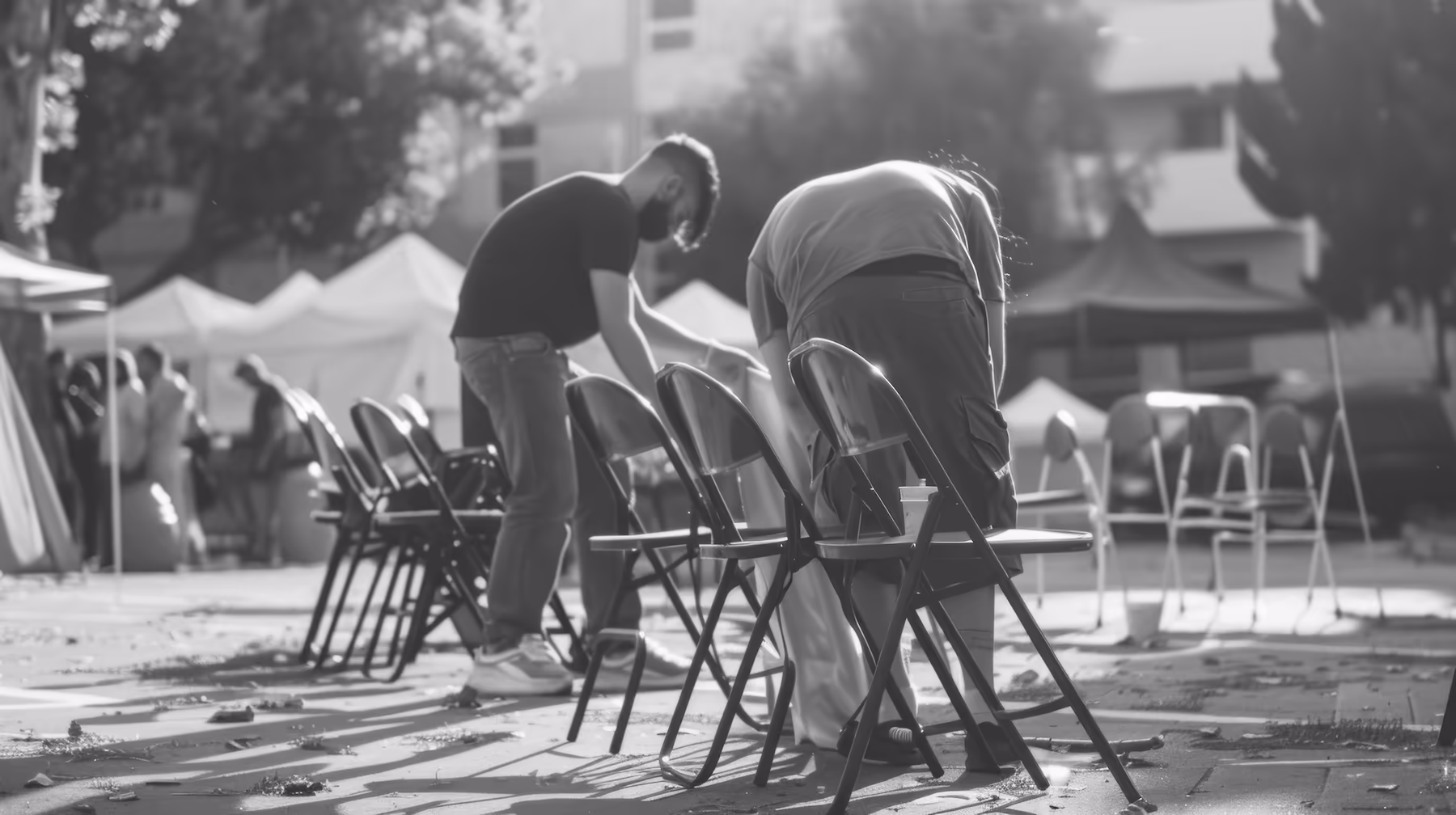 To young men setting up chairs around the mainstage to listen to Brandon Cosby of Flanner House speak.