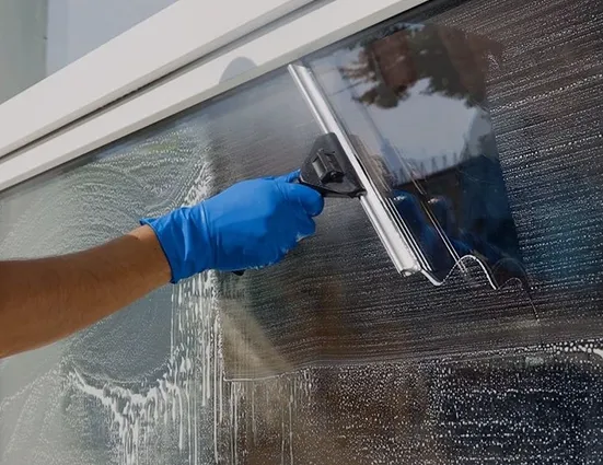 clean corp staff cleaning glass