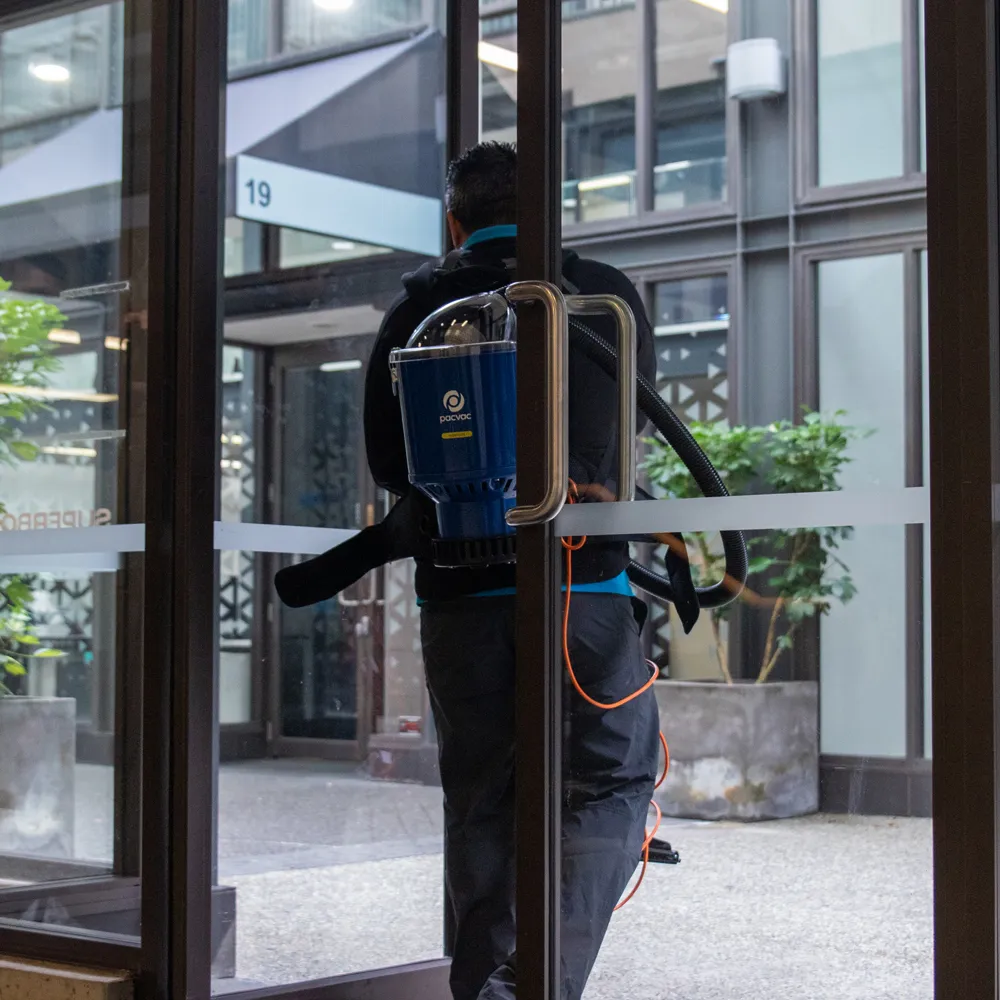 clean corp staff cleaning windows