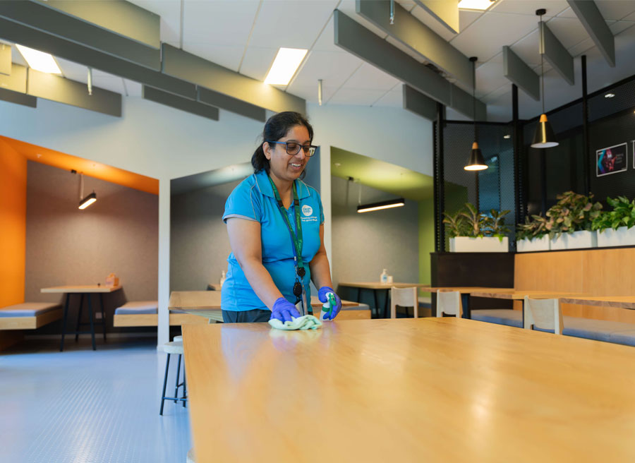 clean corp staff cleaning table