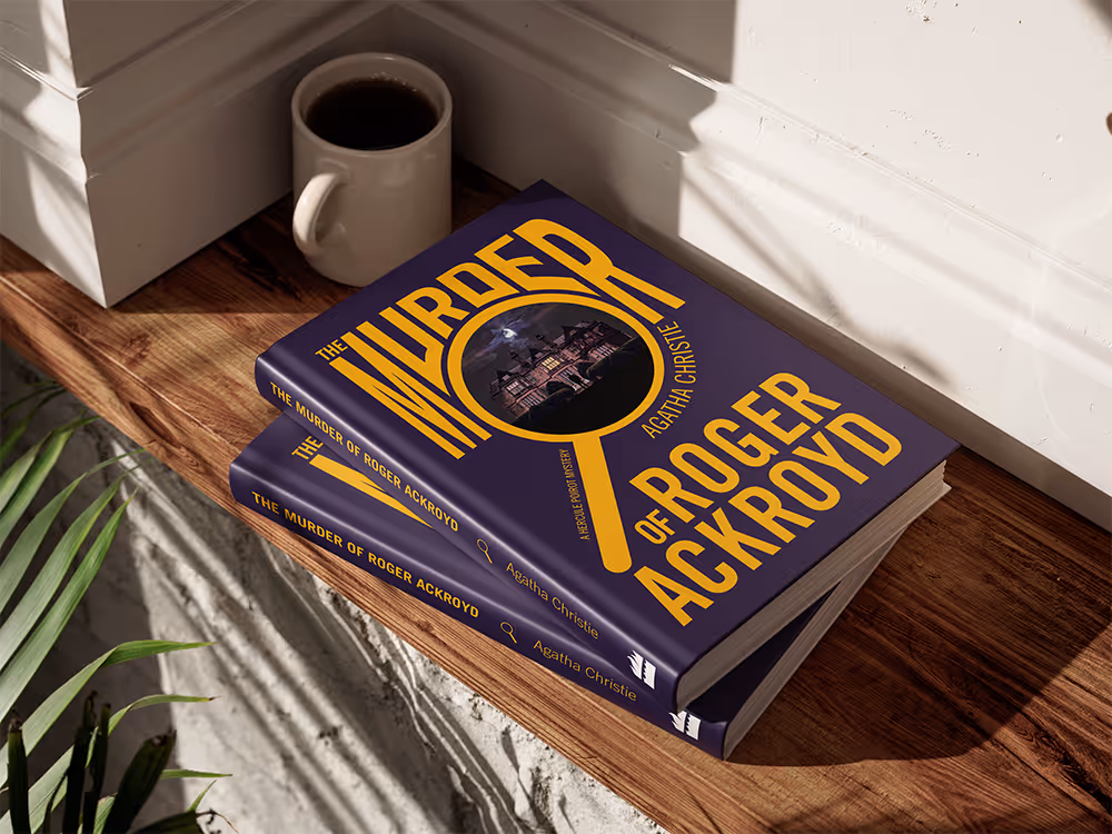 Two The Murder of Roger Ackroyd books lying on top of each other on a wooden shelf.