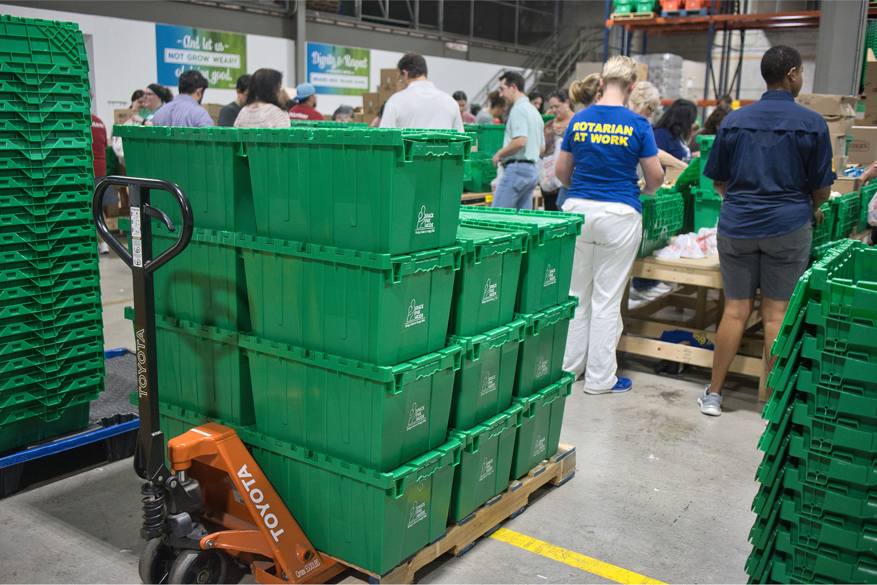 Rotarians packing snack paks Aug 20 2025