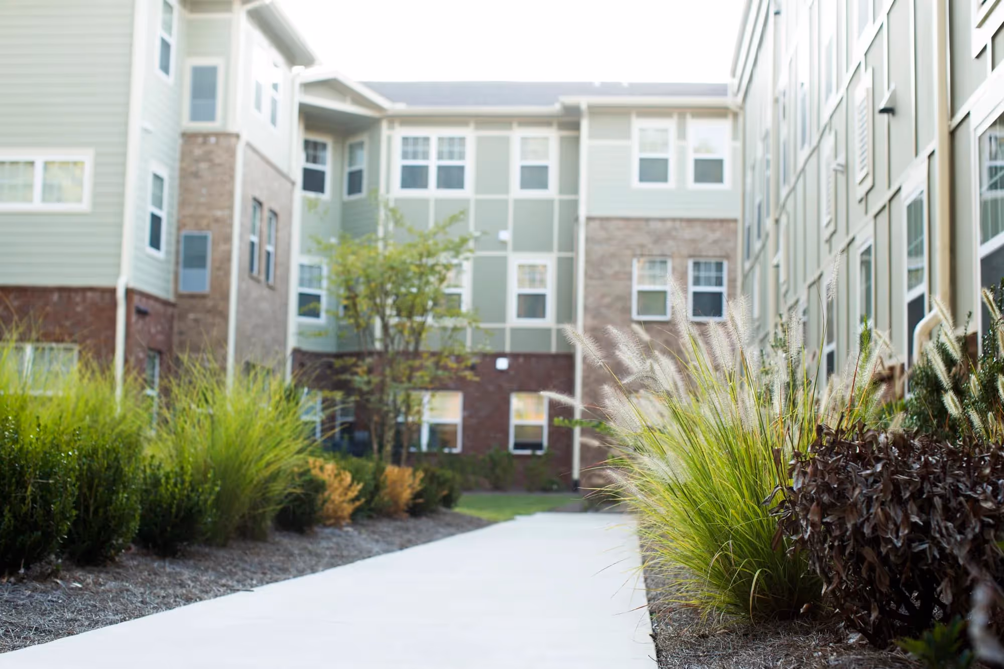 exterior of The Manor at Scotts Crossing with side walk