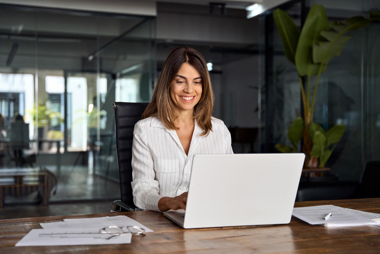 woman smiling on laptop
