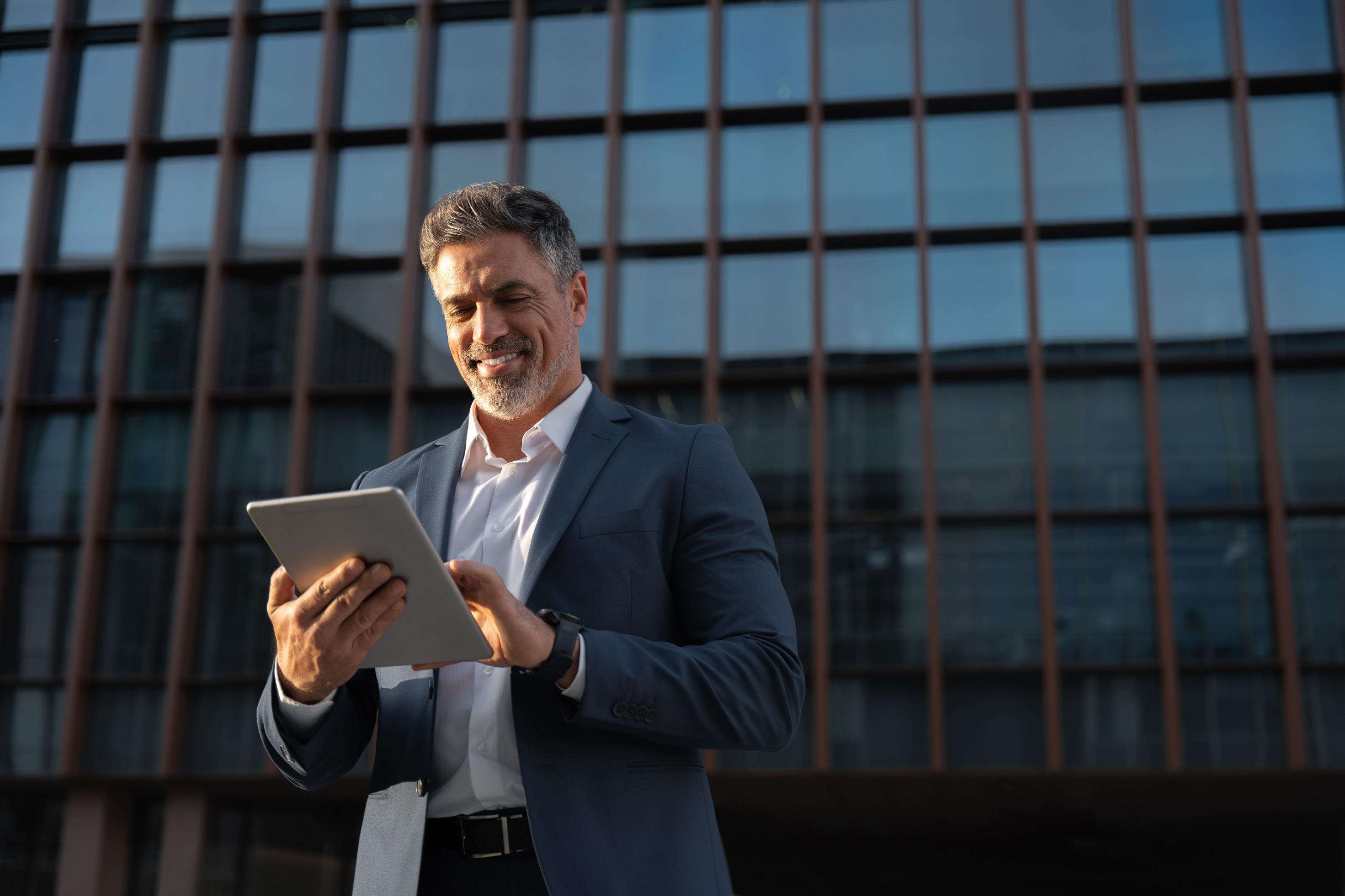 man tapping tablet