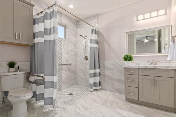 Bathroom with walk-in shower at Ohana Straight Arrow North.