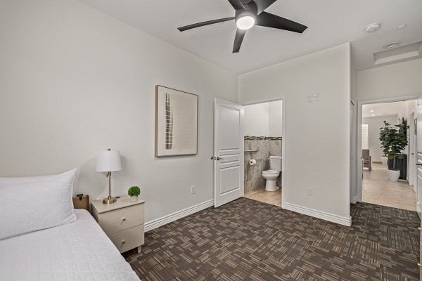 Bedroom with adjoining bathroom at Ohana Straight Arrow South.