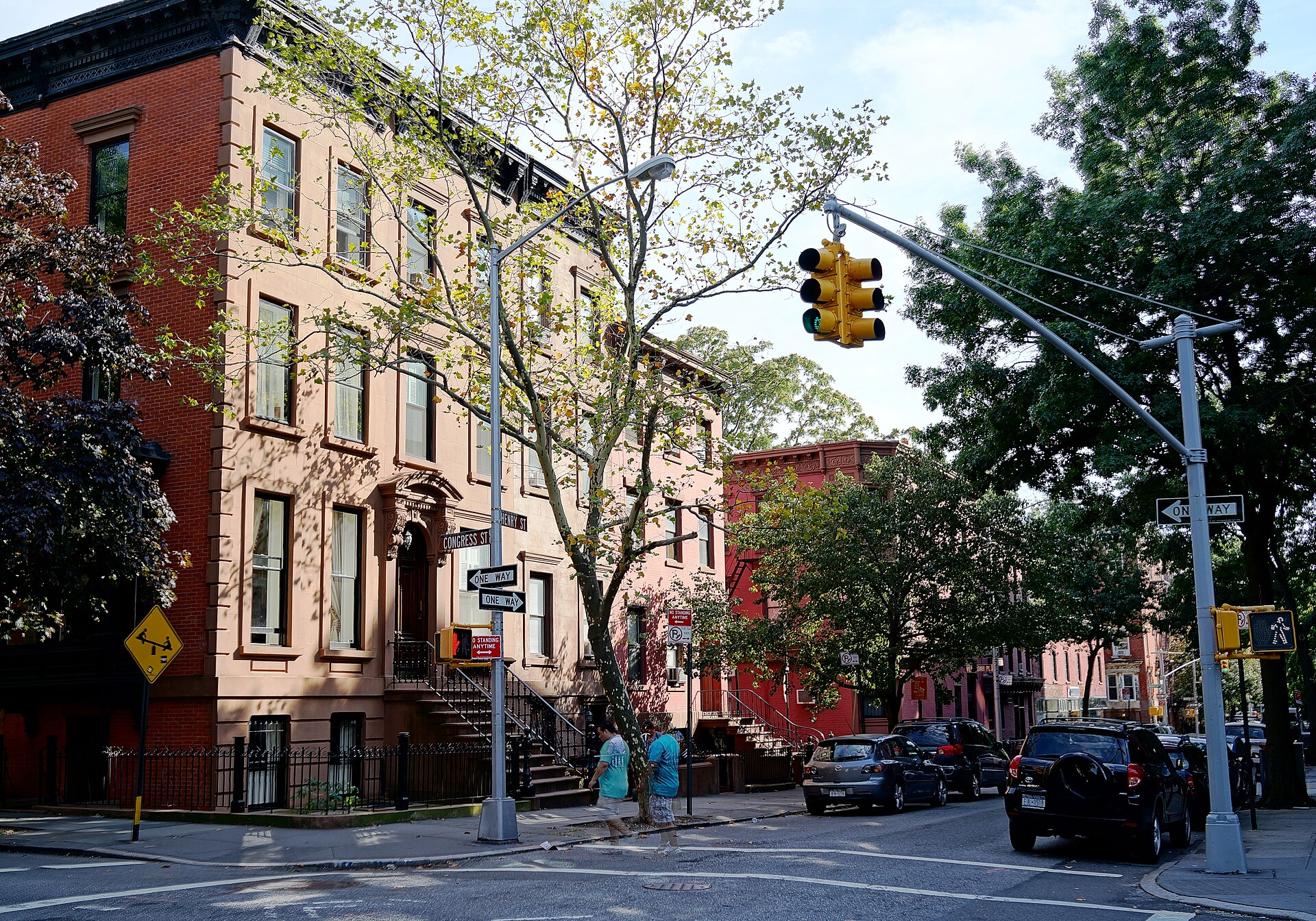 Cobble Hill Park surrounded by historic brownstone rowhouses