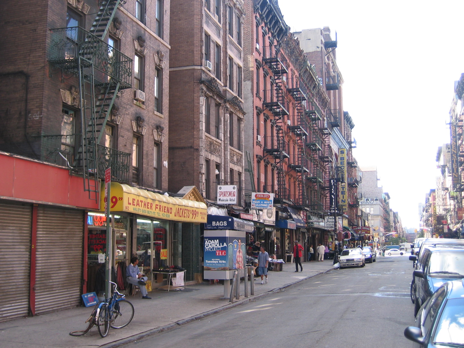 Historic brick tenement streetscape on Orchard Street in the Lower East Side