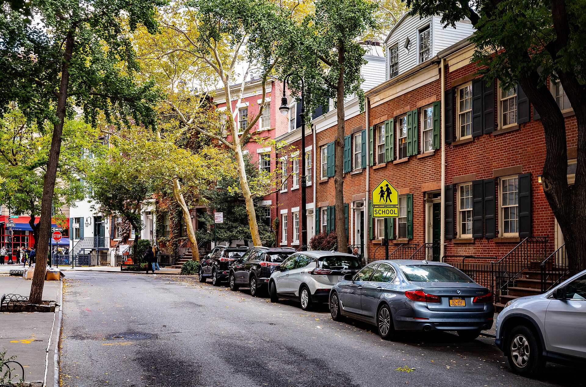 Tree-lined cobblestone street with 19th-century townhouses in the West Village