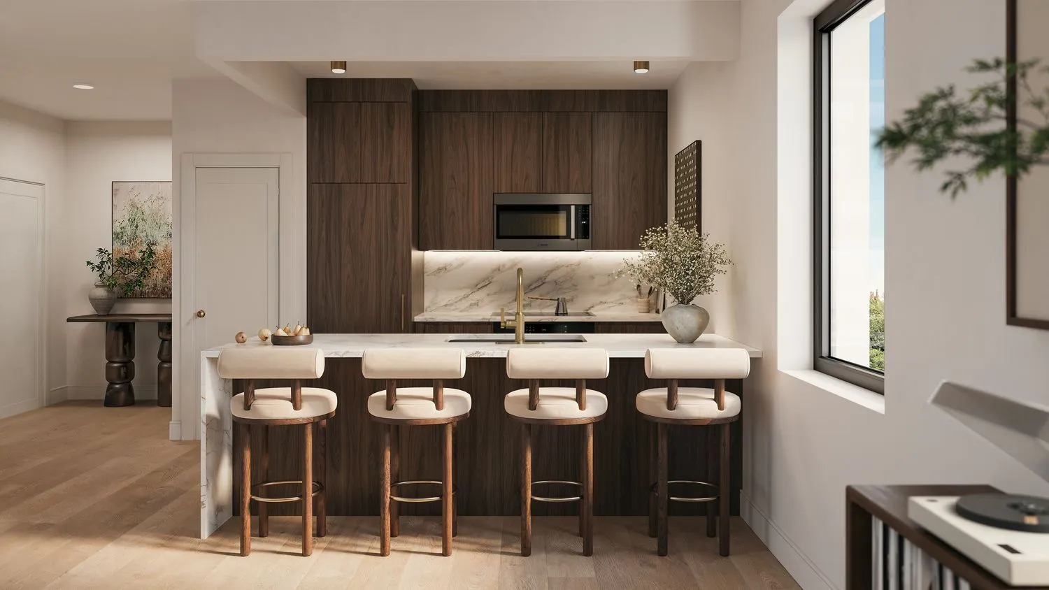 Kitchen with dark wood cabinetry, marble island and bar seating at The Candy Factory, 124 Washington Avenue, Clinton Hill, Brooklyn